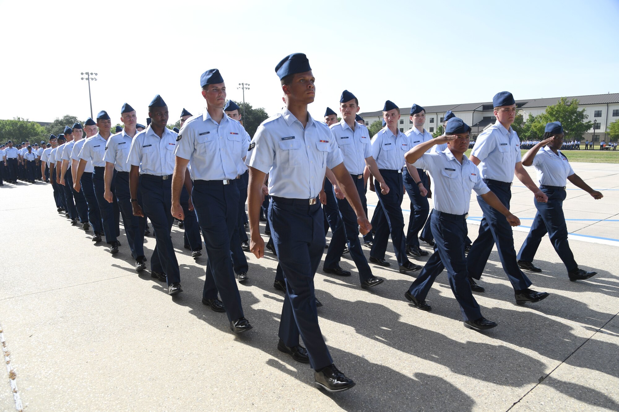 Airmen from the 81st Training Group march in formation during the 81st TRG Change of Command Ceremony on the Levitow Training Support Facility drill pad at Keesler Air Force Base, Mississippi, June 15, 2022. U.S. Air Force Col. Laura King, incoming 81st Training Group commander, assumed command from Col. Chance Geray, outgoing 81st TRG commander. (U.S. Air Force photo by Kemberly Groue)