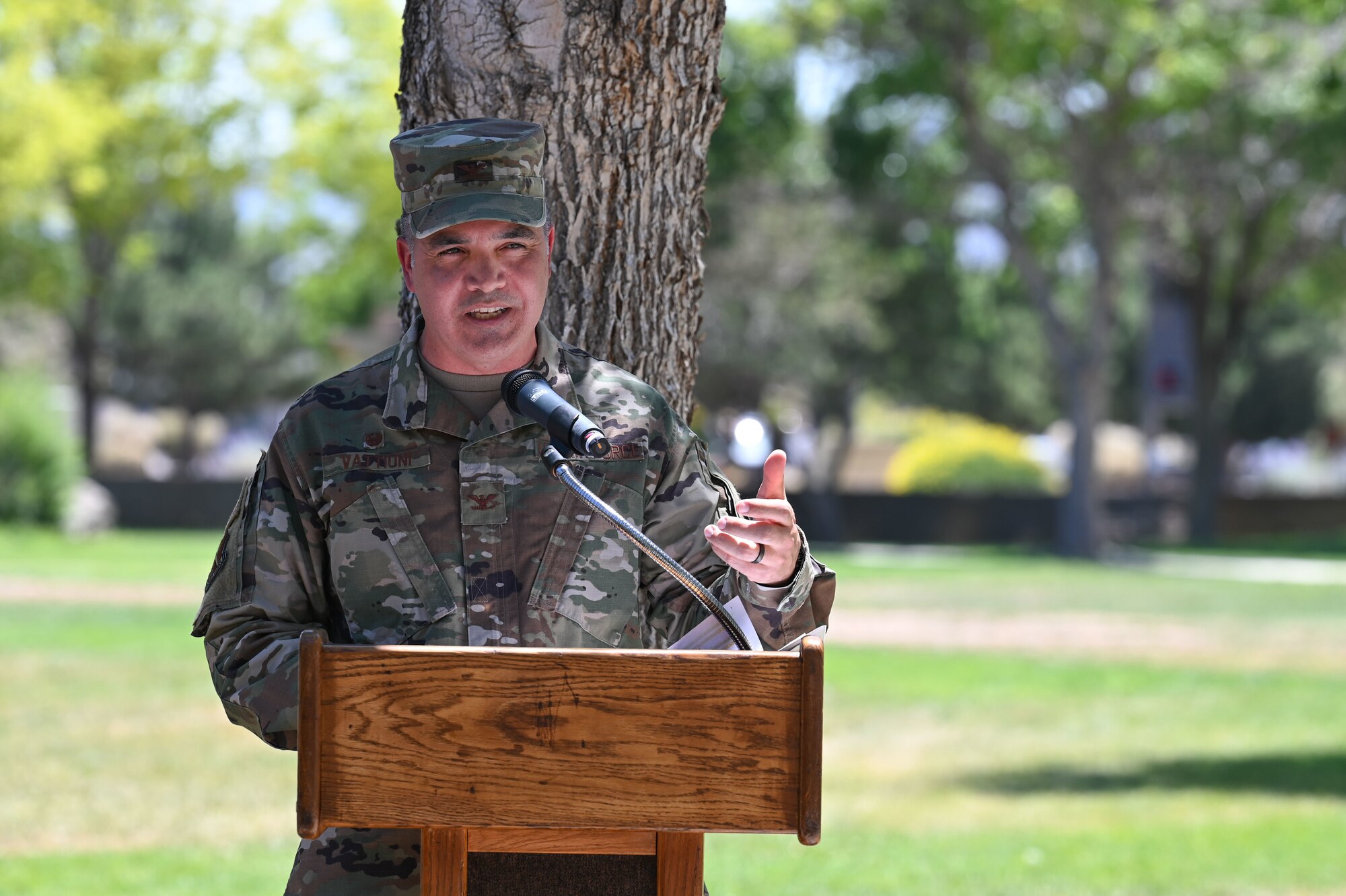 A man speaks at a podium.