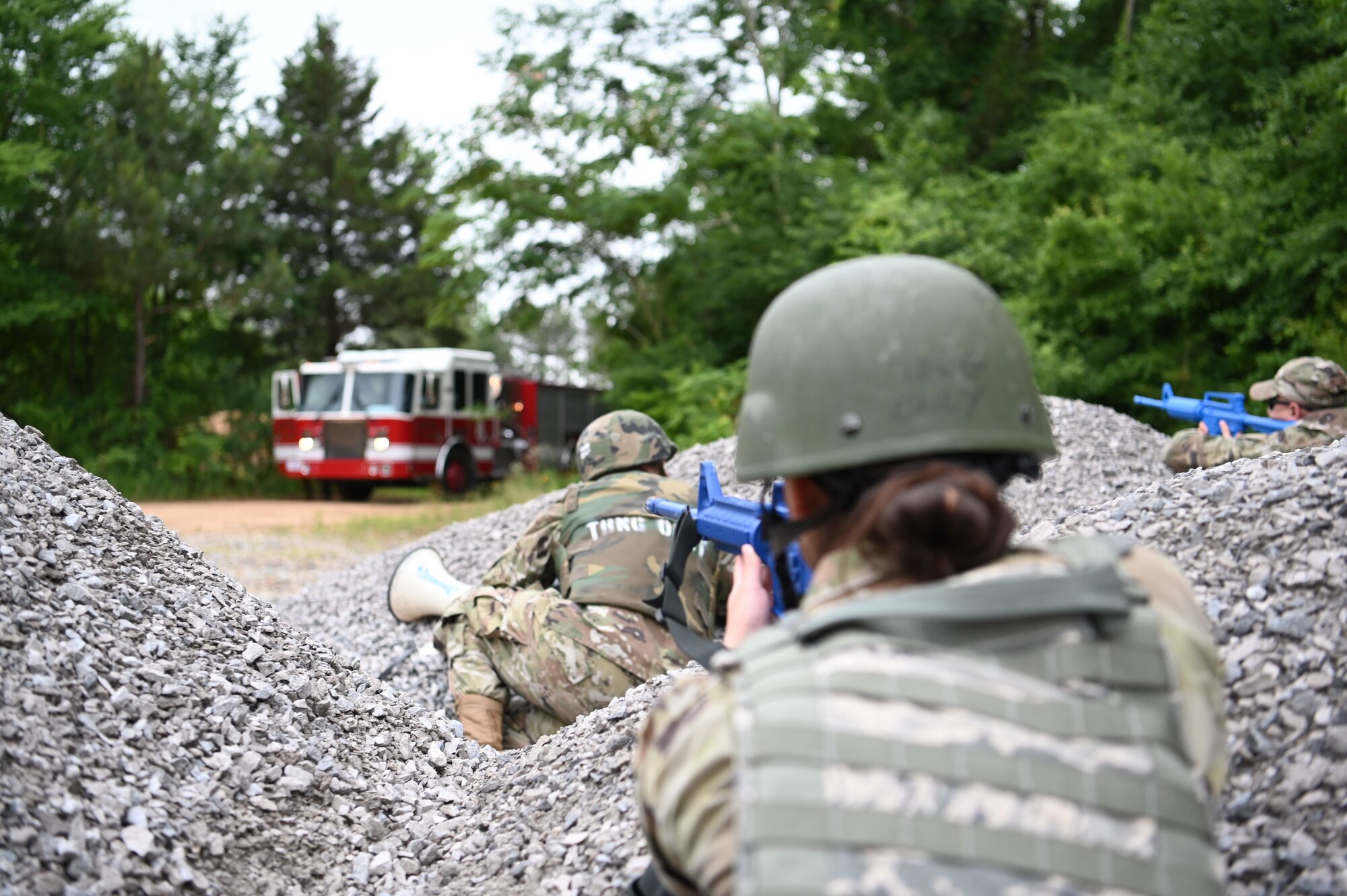 Members of the 14th Civil Engineer Squadron act as attackers on a convoy during the CE 96-hour readiness exercise, May 24, 2022, on Columbus Air Force Base, Miss. The exercise helped prepare 14th CES military members on contingency operations in a simulated deployed conditions. (U.S. Air Force photo by 2nd Lt. Peyton Craven)