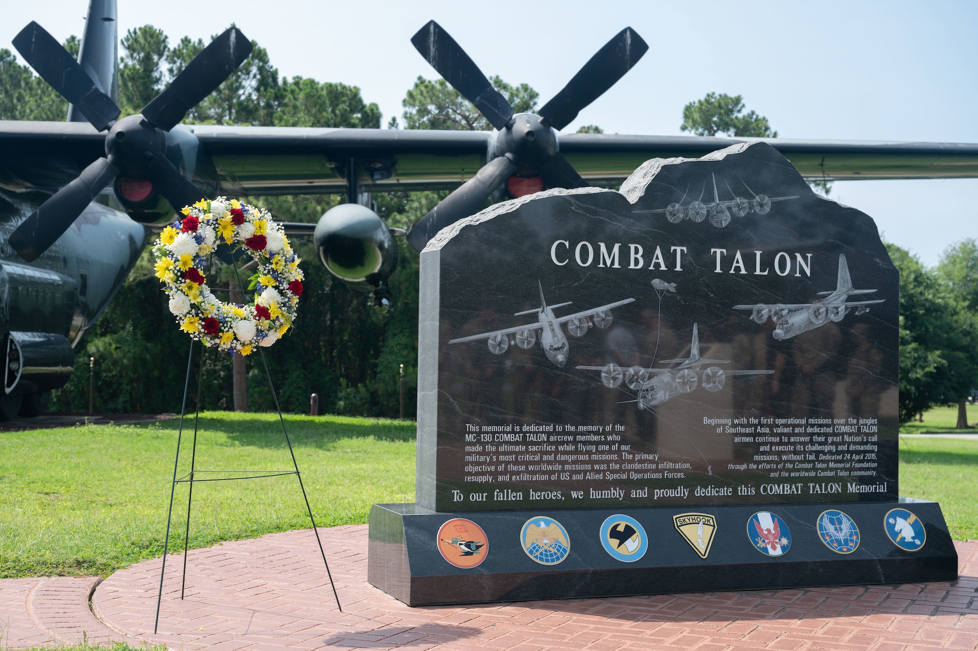 A ceremonial wreath is displayed next to the Combat Talon Memorial in honor of the 20th anniversary of Chariot 55 at Hurlburt Field, Florida, June 10, 2022.