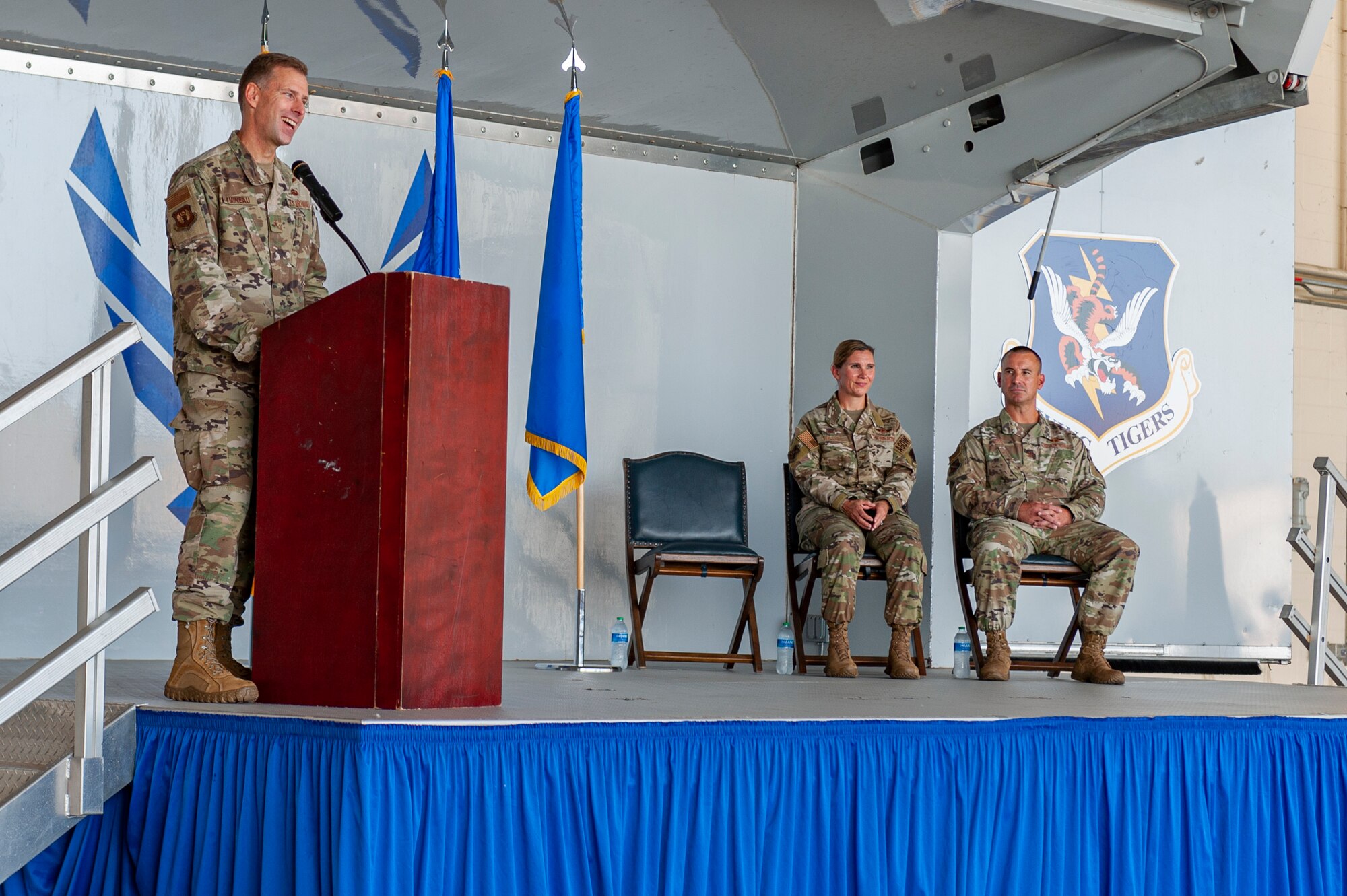 Photo of an Airman speaking during a ceremony