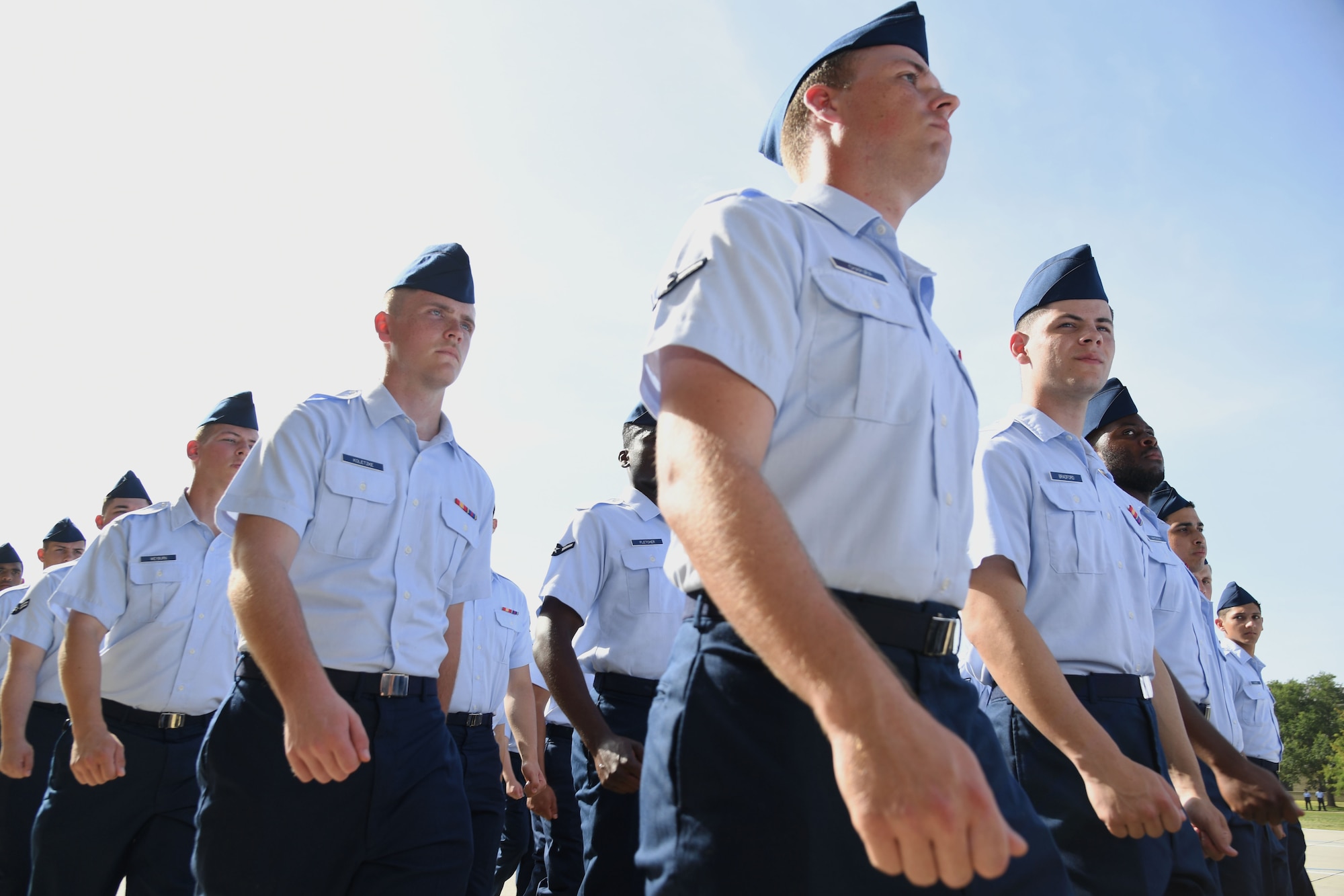 Airmen from the 81st Training Group march in formation during the 81st TRG Change of Command Ceremony on the Levitow Training Support Facility drill pad at Keesler Air Force Base, Mississippi, June 15, 2022. U.S. Air Force Col. Laura King, incoming 81st Training Group commander, assumed command from Col. Chance Geray, outgoing 81st TRG commander. (U.S. Air Force photo by Kemberly Groue)