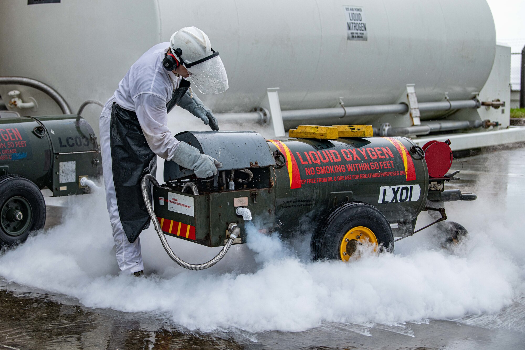 Airman prepares a liquid oxygen cart.