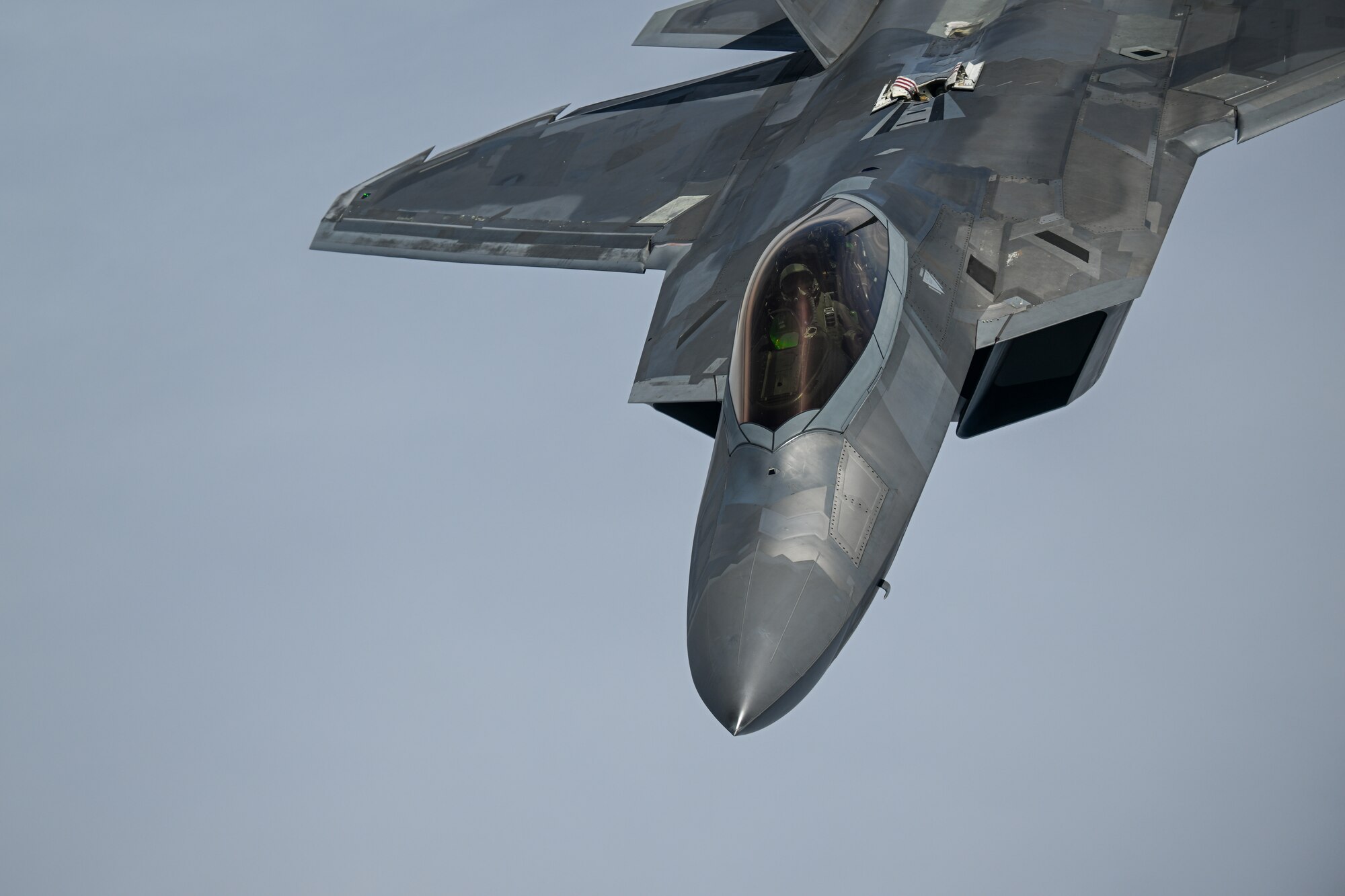 A U.S. Air Force F-22 Raptor, deployed to Kadena Air Base, Japan, approaches a KC-135 Stratotanker assigned to the 909th Air Refueling Squadron, Kadena AB, for aerial refueling, June 10, 2022. Kadena Air Base regularly hosts visiting joint, allied and partner forces to conduct missions to enhance our operational readiness to defend Japan and ensure a free-and-open Indo-Pacific. (U.S. Air Force photo by Tech. Sgt. Corban Lundborg)