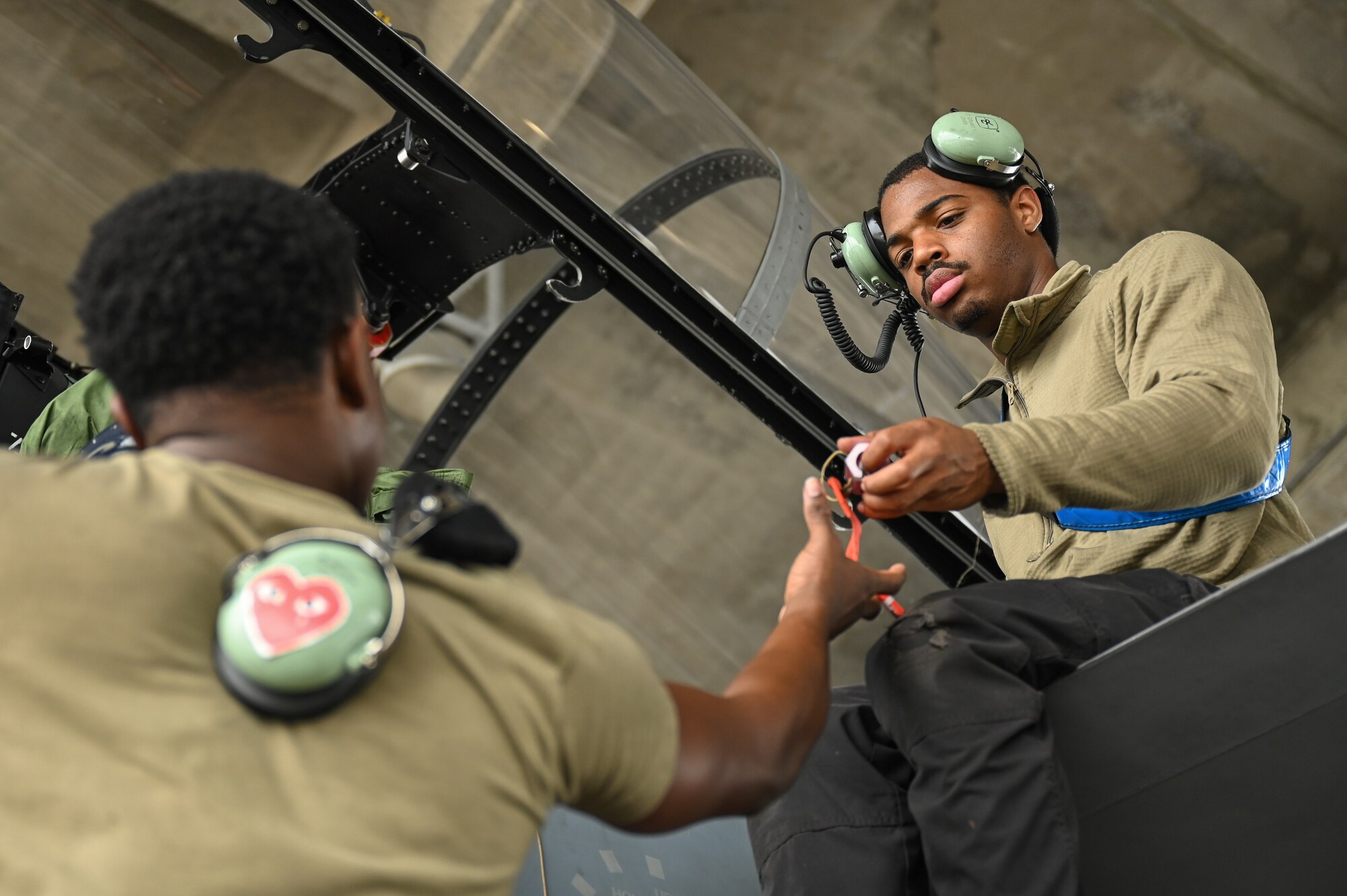 Photo of a U.S. Airman conducting a pre-flight check.