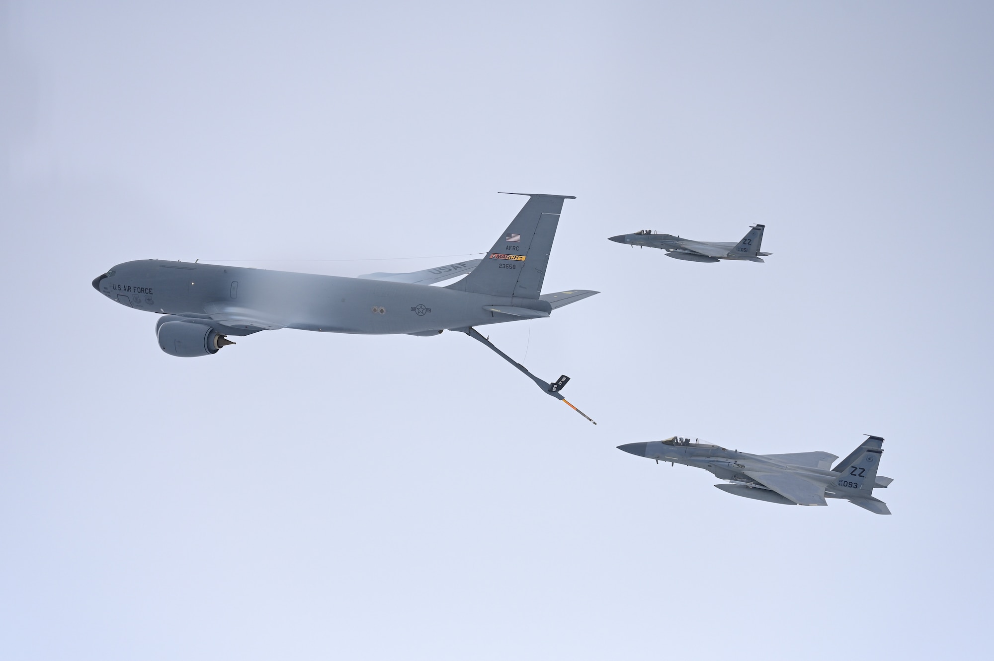 Photo of a U.S. Air Force KC-135 Stratotanker refueling two F-15 Eagles.