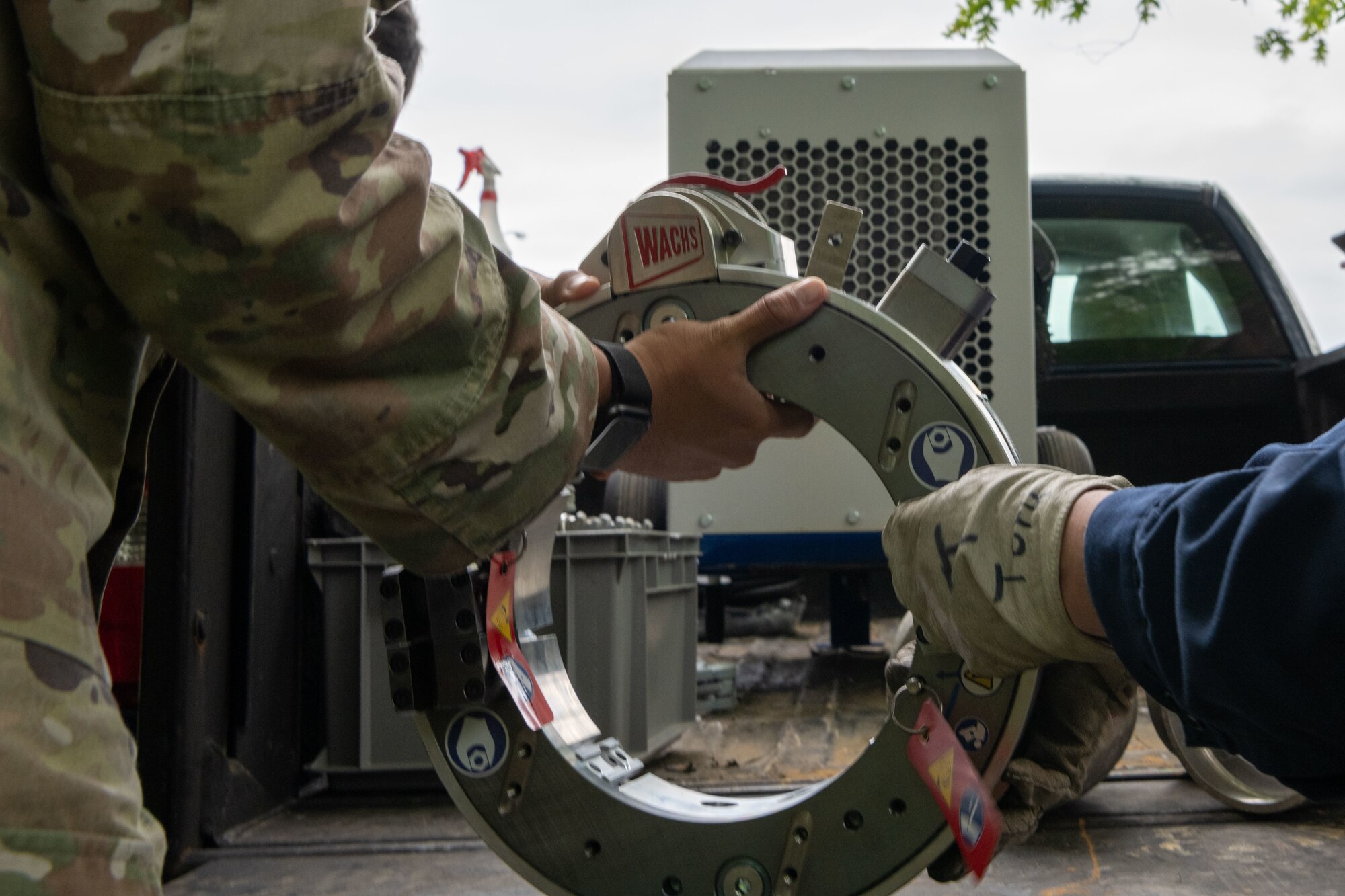 U.S. Air Force Senior Airman Joshua Sanchez, 35th 35th Civil Engineer Squadron water and fuel system journeyman, holds the Water and Fuel Expedient Repair System (WaFERS) in place while putting it together during setup for the annual Prime Base Engineer Emergency Force (Prime BEEF) at Misawa Air Base, Japan, June 13, 2022.
