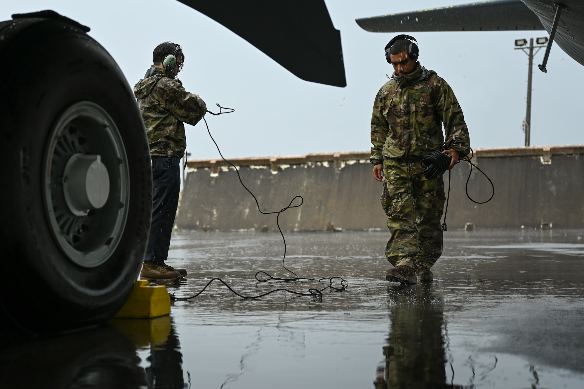 Photo of airmen conducting pre-flight checks.