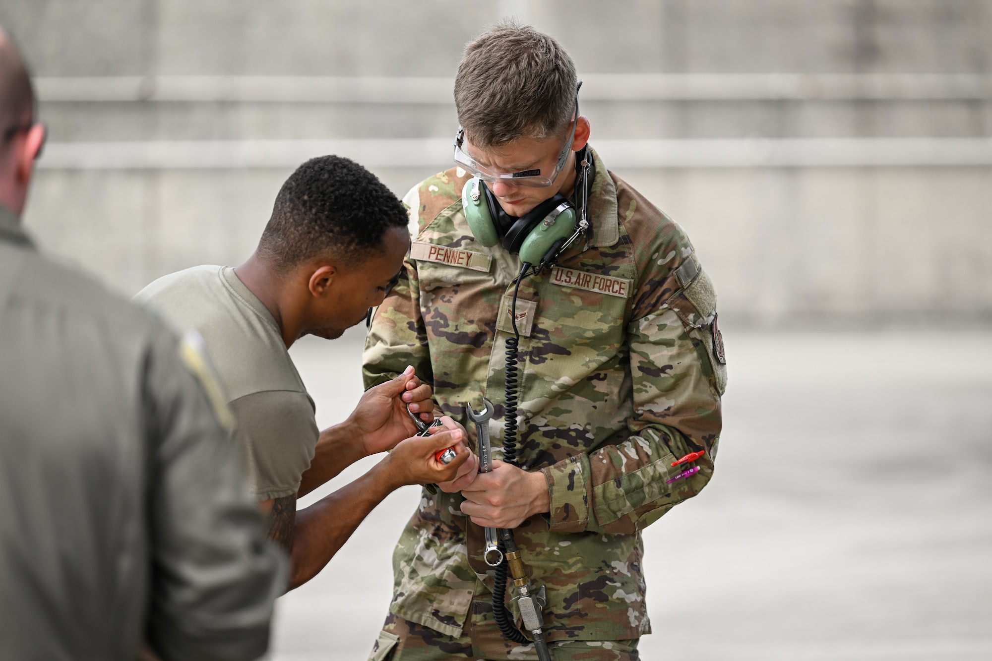 Photo of airman conducting pre-flight checks.