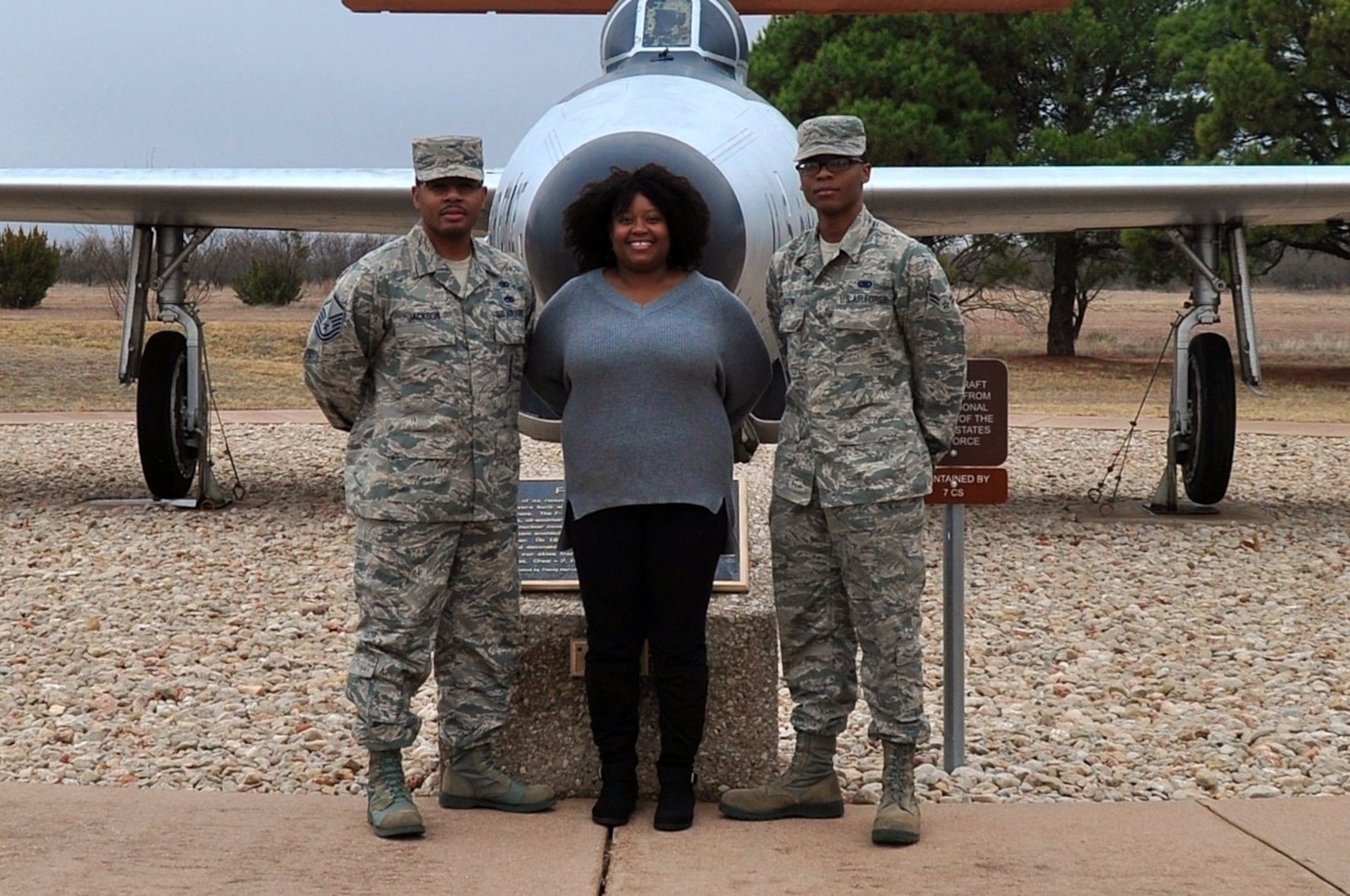 Airmen and family standing together