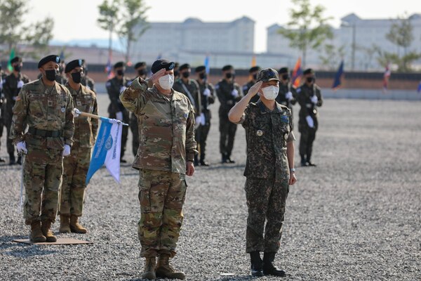 Gen. Won In-choul and Gen. Paul J. LaCamera salute the colors during a farewell ceremony at Barker Field on U.S. Army Garrison Humphreys.