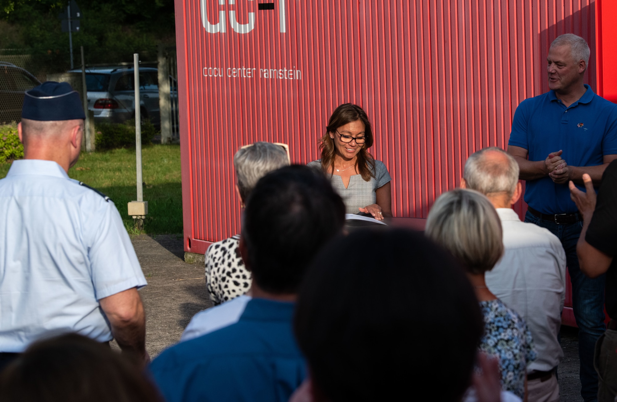 Raquel Fischer, 86th Airlift Wing vice director, speaks to attendees during the opening ceremony of the 70 years of Ramstein Air Base Exhibit at the Docu Center Ramstein-Miesenbach, Germany, June 15, 2022.