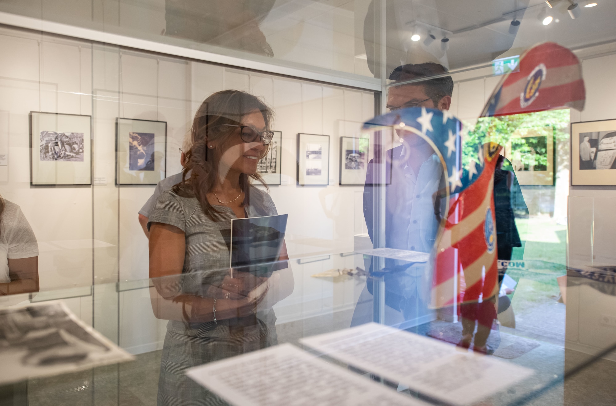 Raquel Fischer, 86th Airlift Wing vice director, tours the 70 years of Ramstein Air Base Exhibit at the Docu Center Ramstein, Germany, June 15, 2022.
