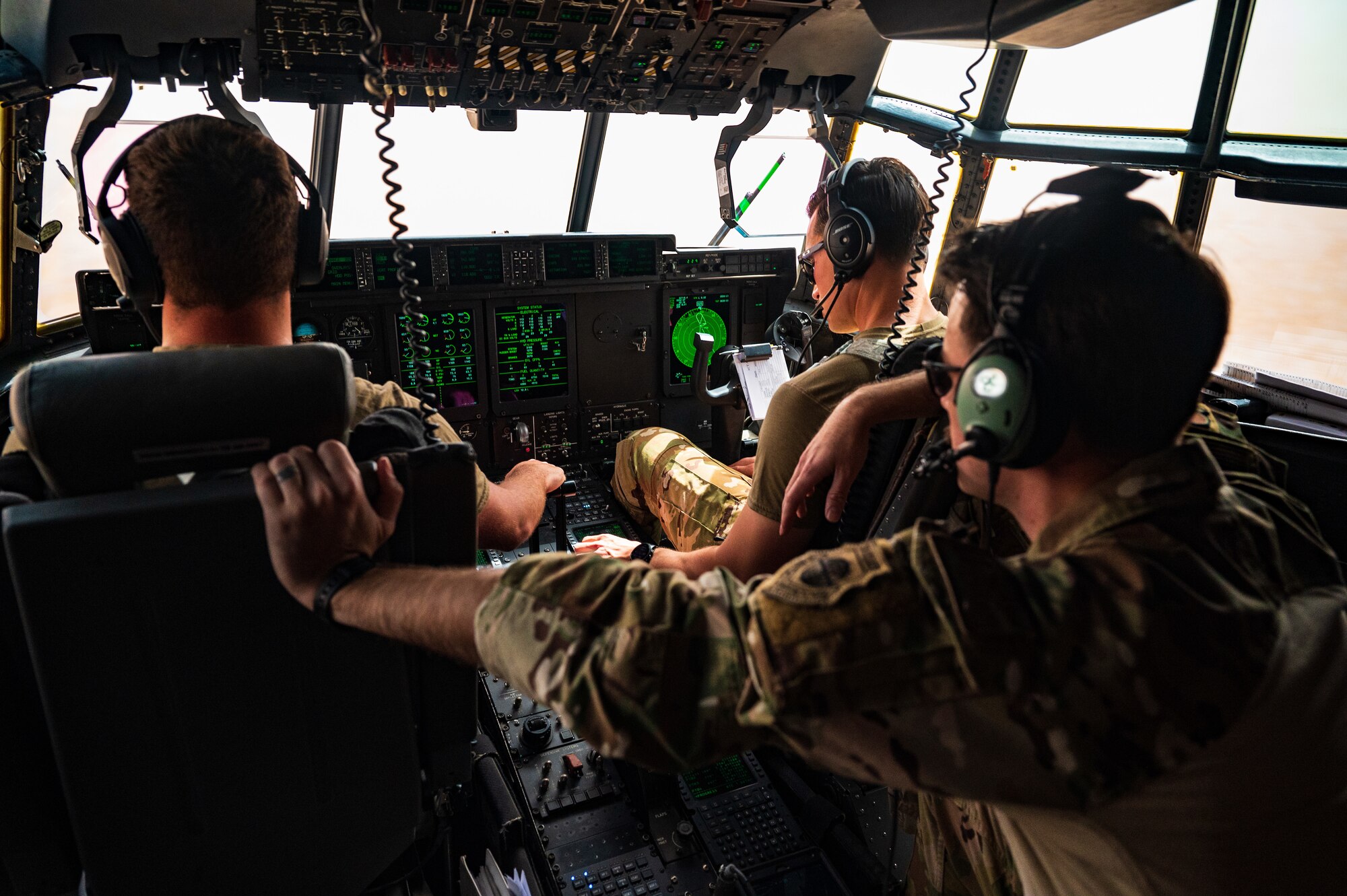 U.S. Air Force Airmen assigned to the 41st Expeditionary Airlift Squadron fly in a combat exercise during Accurate Test 22, May 19, 2022. This exercise, which took place alongside a Royal Air Force of Oman C-130 aircraft, simulated a low altitude pursuit which caused the U.S. C-130 flight crew to employ tactical evasive maneuvers in conjunction with simulating a mid-flight payload drop. (U.S. Air Force photo by Staff Sgt. Dana Tourtellotte)