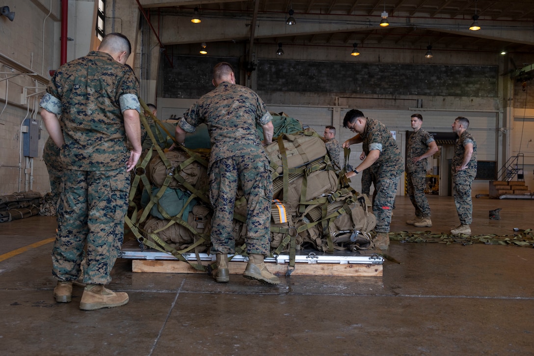 U.S. Marines with 3rd Marine Expeditionary Brigade Alert Contingency Marine Air Ground Task Force, secure gear and equipment to pallets during an ACM drill on Marine Corps Air Station Futenma, Okinawa, Japan, June 8, 2022. 3RD MEB is III Marine Expeditionary Force’s Fire Brigade, ready to respond to a wide range of crisis events throughout the Indo-Pacific region as a command-and-control node or as the nucleus of a Joint Task Force, from delivering humanitarian assistance during natural disasters to combat operations. This ACM drill showcased the 3RD MEB’s readiness and validated its ability to rapidly activate and deploy a Forward Command Element.