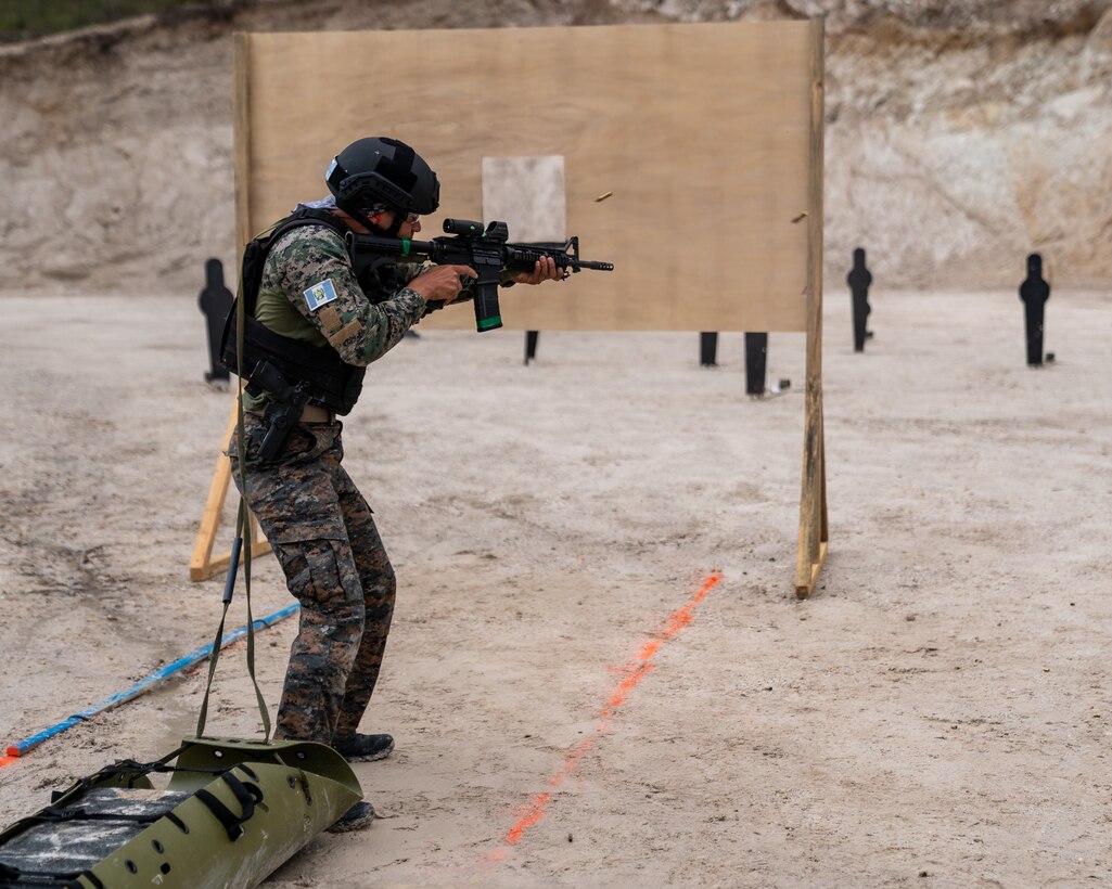 A Guatemalan team member fires his rifle at targets as part of Fuerzas Comando 2022.