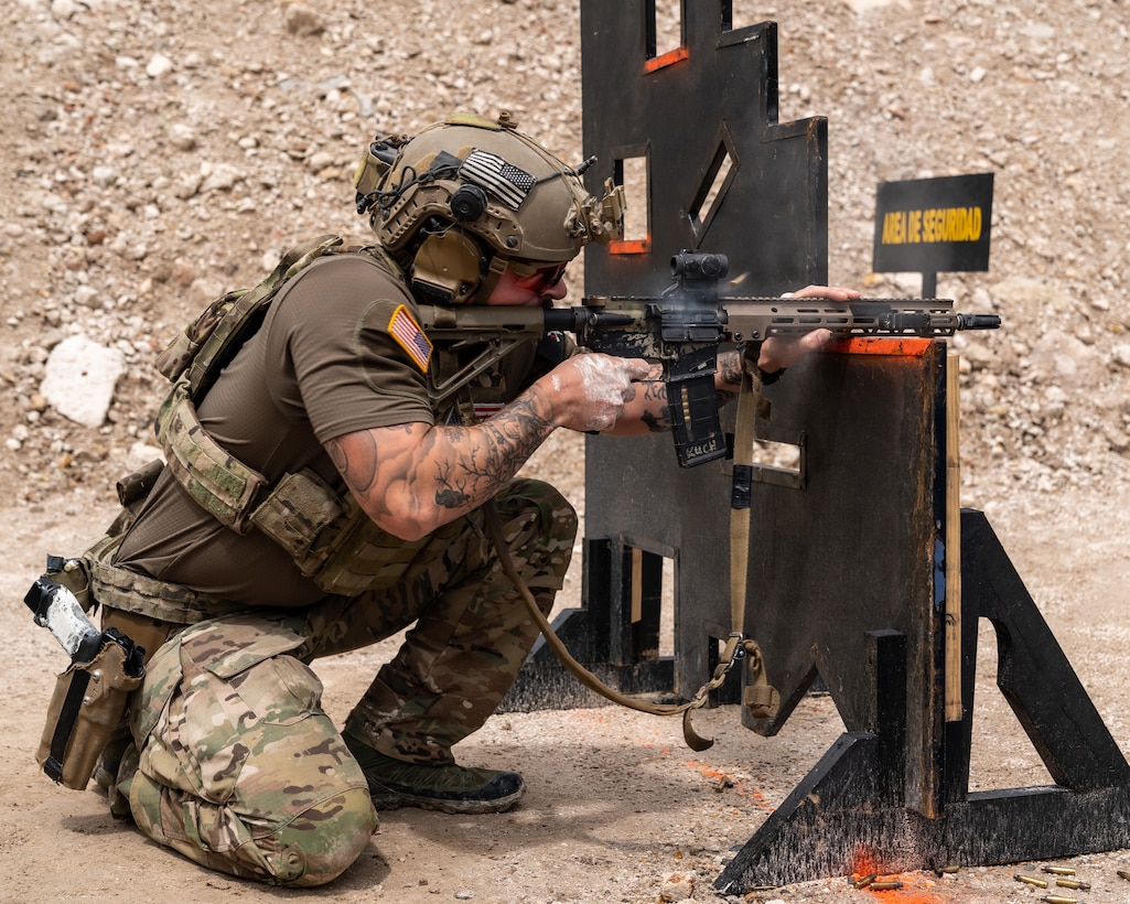 A United States team member fires his rifle at targets as part of Fuerzas Comando 2022.