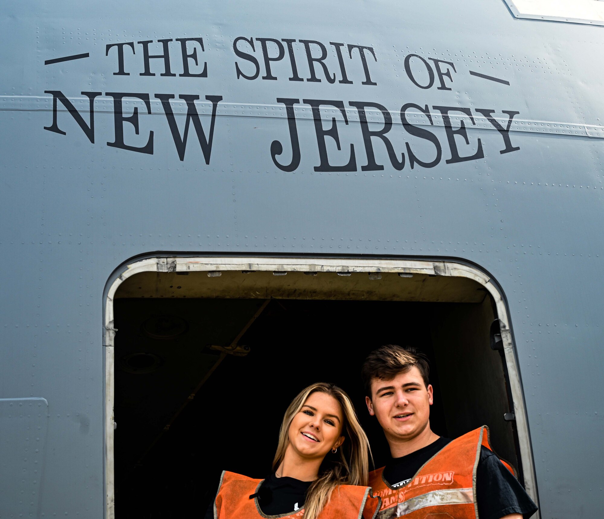 Formula Drift drivers Branden and Amanda Sorenson pose for a photo at the crew door of a C-17 Globemaster III aircraft at Joint Base McGuire-Dix-Lakehurst on June 7, 2022. Drift team duo Branden and Amanda Sorensen visited JB MDL to interact with Airmen and learn about different Air Force career fields. Air Force Recruiting Service recently continued their 13-year partnership with the Formula Drift series. Throughout the 2022 Formula Drift circuit, the Air Force will serve as the primary sponsor for the Sorensen Motorsports team.