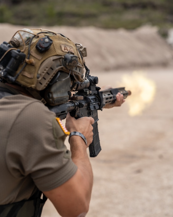 A United States team member fires his rifle at targets as part of Fuerzas Comando 2022.