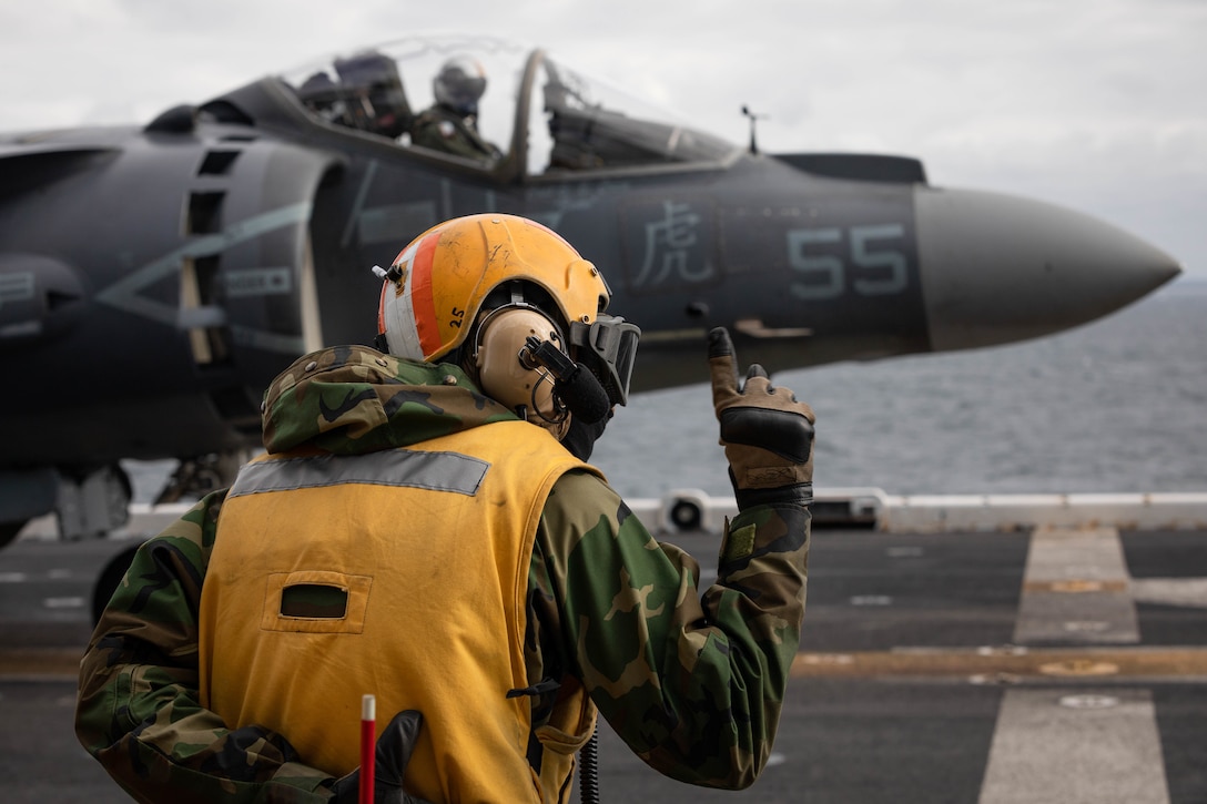 220614-N-MZ836-1095 BALTIC SEA (June 14, 2022) Aviation Boatswain's Mate (Handling) 1st Class Tu N. Chau directs an AV-8B Harrier, attached to the 22nd Marine Expeditionary Unit, aboard the Wasp-class amphibious assault ship USS Kearsarge (LHD 3) during exercise BALTOPS 22, June 14, 2022. BALTOPS 22 is the premier maritime-focused exercise in the Baltic Region. The exercise, led by U.S. Naval Forces Europe-Africa, and executed by Naval Striking and Support Forces NATO, provides a unique training opportunity to strengthen combined response capabilities critical to preserving freedom of navigation and security in the Baltic Sea. (U.S. Navy photo by Mass Communication Specialist 3rd Class Jesse Schwab)
