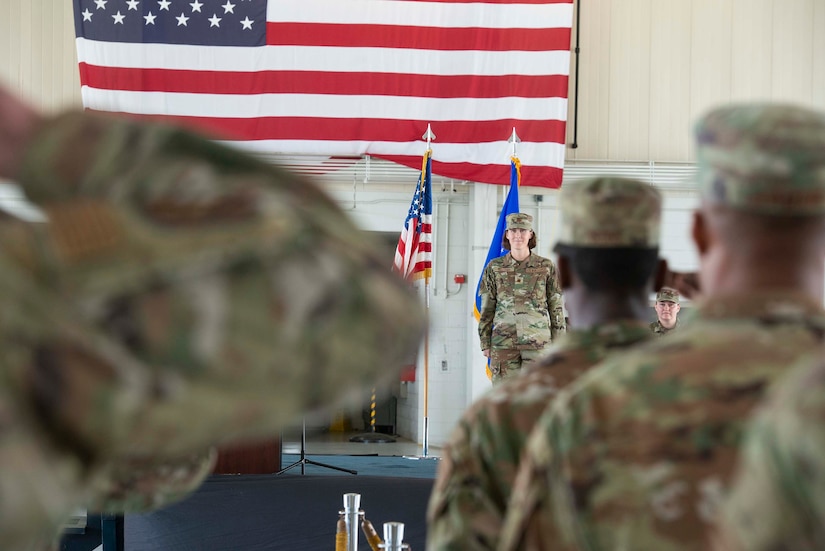 Airmen stands at attention.