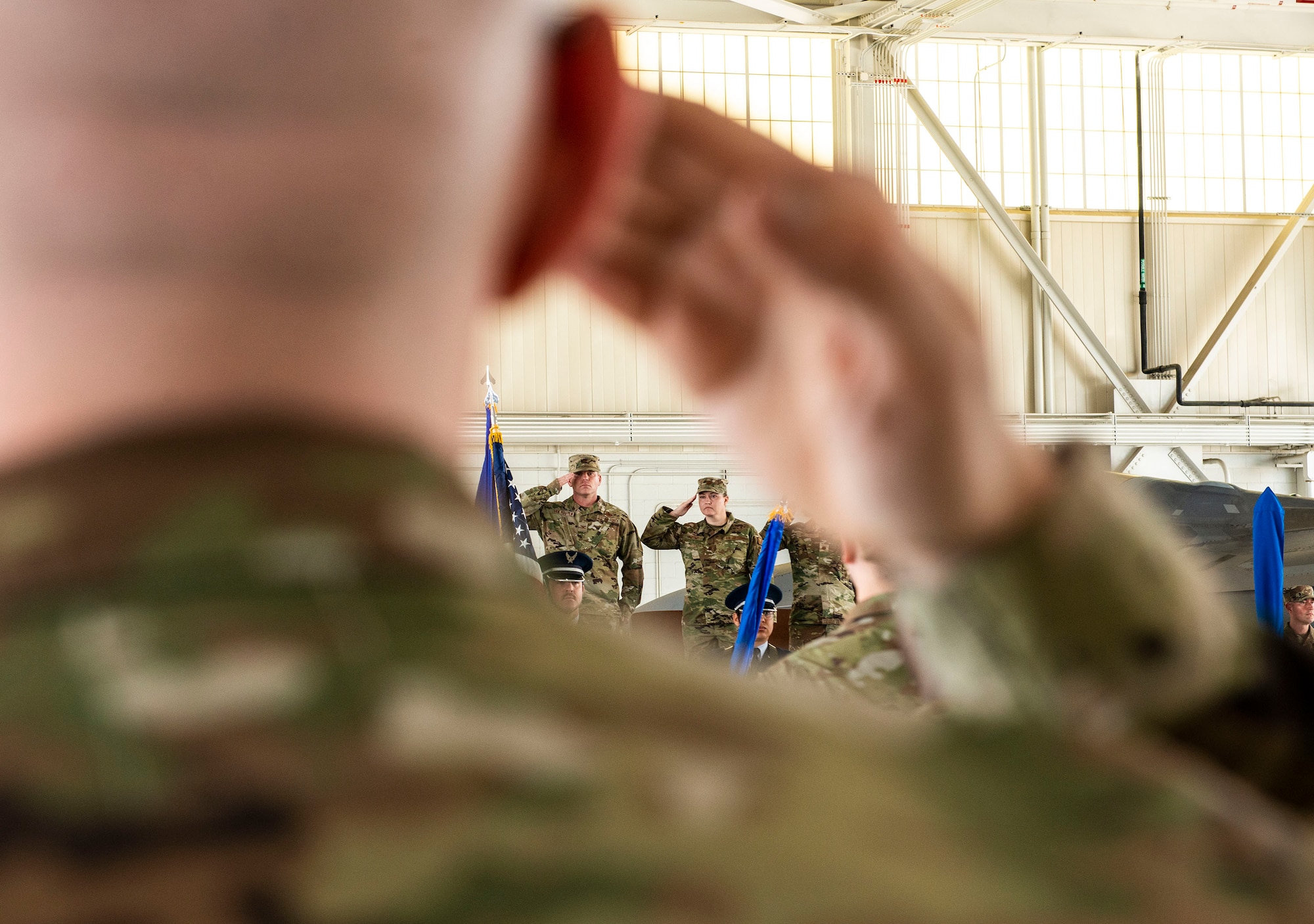 Airmen render salutes.