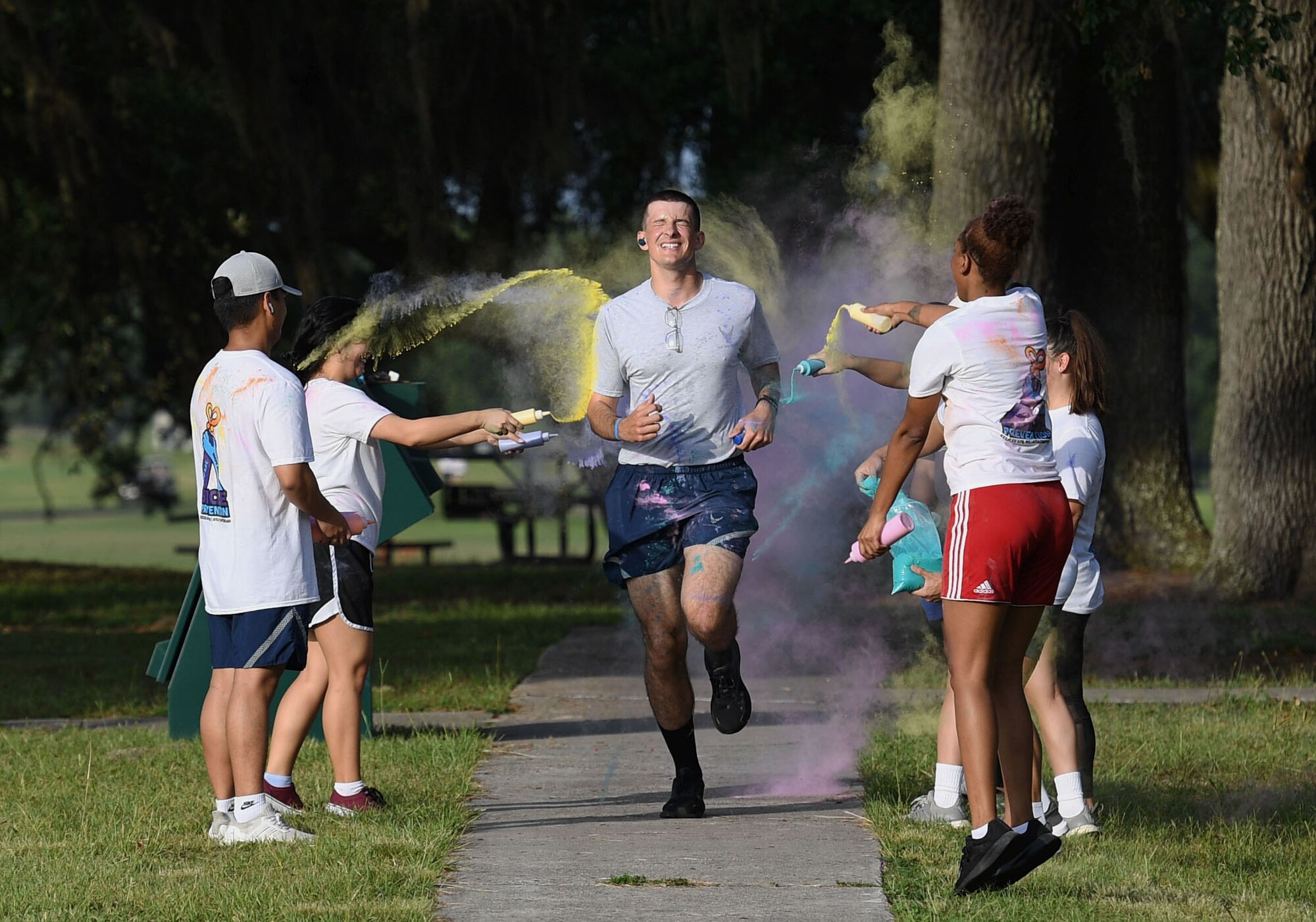 Keesler personnel participate in the Suicide Prevention Color Run at marina park at Keesler Air Force Base, Mississippi, June 16, 2022. More than 250 runners and 70 volunteers participated in the Air Force Sergeants Association Chapter 652 hosted event. (U.S. Air Force photo by Kemberly Groue)