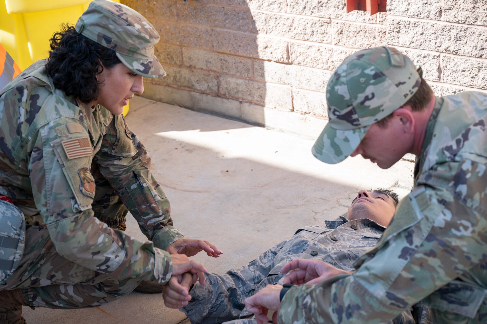 Students from the 4-day Tactical Combat Casualty Care (TCCC) and Combat LifeSaver (CLS) courses taught by 162nd Medical Group personnel practice on patients with simulated injuries during an “active shooter” exercise at Morris Air National Guard Base here today.