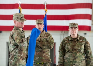 Airmen unveils casing for guidon.