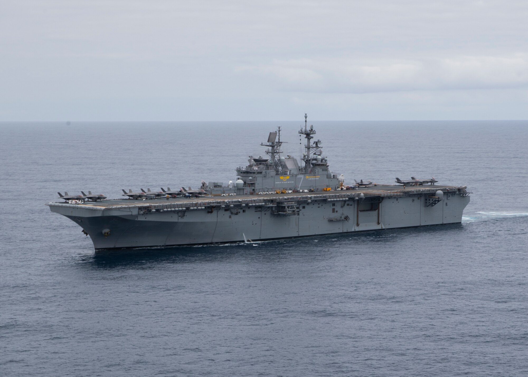 Amphibious assault ship USS Tripoli (LHA 7) steams through the Pacific Ocean while conducting flight operations as part of the U.S. Marine Corps’ Lightning carrier concept demonstration. VMFA 211is embarked aboard Tripoli as part of the U.S. Marine Corps’ Lightning carrier concept demonstration. The Lightning carrier concept demonstration shows Tripoli and other amphibious assault ships are capable of operating as dedicated fixed-wing carrier platforms, capable of bringing fifth generation Short Takeoff/Vertical Landing aircraft wherever they are required. (U.S. Navy photo by Mass Communication Specialist 3rd Class Christopher Sypert)