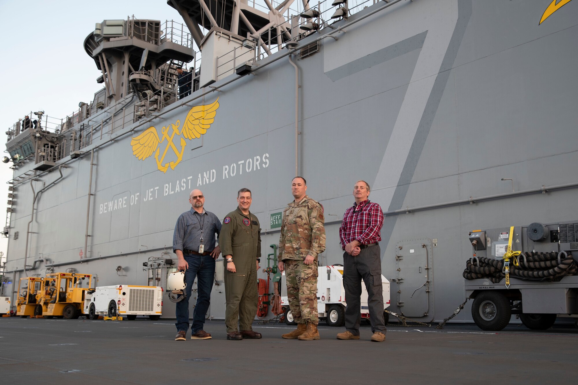 U.S. Operational Test Team members aboard the USS Tripoli (LHA-7).  From the left, Andy Komen, LtCol David "Penguin" Merritt, MSgt Eric Tate, and Jason Gantert.