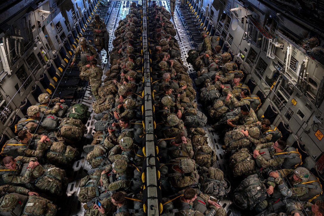 U.S. Army Paratroopers, Air Force joint terminal attack controller and Special Tactic Operators board a C-17 Globemaster III from the 517th Airlift Squadron at Joint Base Elmendorf-Richardson, Alaska, June 15, 2022 during RED FLAG-Alaska 22-2. Approximately 1,600 service members from three nations participate in flying, maintaining and supporting more than 70 aircraft from over 22 units during this iteration of exercise. The Paratroopers are assigned to the 2nd Infantry Brigade Combat Team (Airborne), 11th Airborne Division, JTACs are assigned to the 3rd Air Operation Squadron both at JBER and ST operators are assigned to the 23rd Special Tactics Squadron, Hurlburt Field, Florida. (U.S. Air Force photo by Sheila deVera)