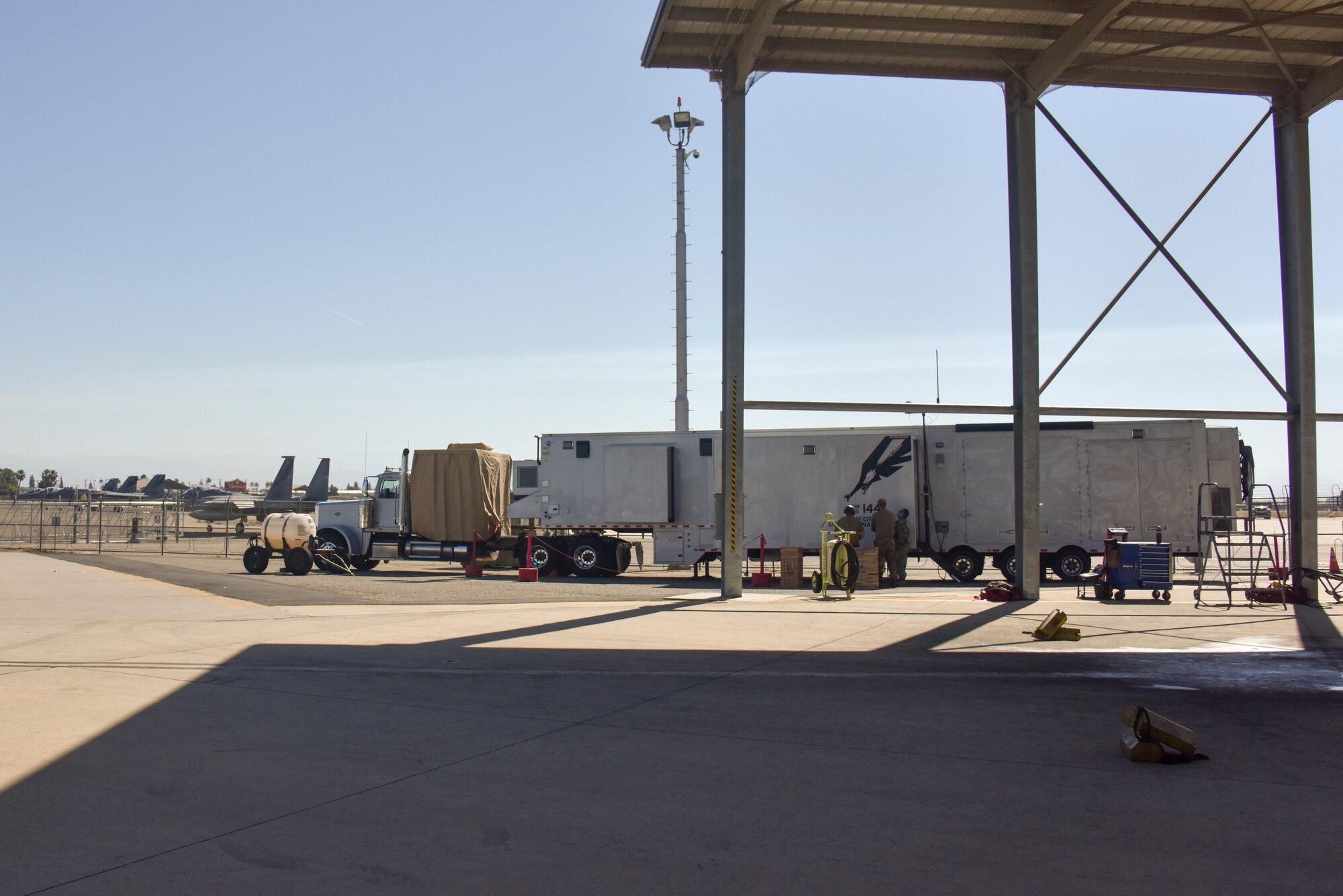 An adaptive basing trailer, which is a one-of a kind prototype that was developed by Airmen from the 144th Fighter Wing, is parked on the flightline at the Fresno Air National Guard while conducting operational proof-of-concept tests to launch and recovery F-15C Eagles, June 9, 2022.