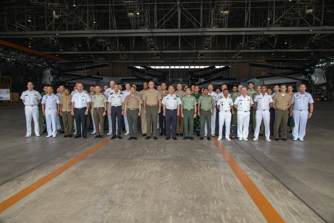 Delegation leaders pose for a photo during a capabilities demonstration as part of the Pacific Amphibious Leaders Symposium, Camp Kisarazu, Japan, June 16, 2022. This iteration of PALS brought senior leaders of allied and partnered militaries together to discuss amphibious force readiness, expeditionary advanced base operations, intermediate force capabilities, and ways to improve interoperability between partners within the Indo-Pacific region. A total of 18 participating delegations from Asia, Australia, Europe, South America, and North America participated in the symposium. (U.S. Marine Corps photo by Lance Cpl. Haley Fourmet Gustavsen)
