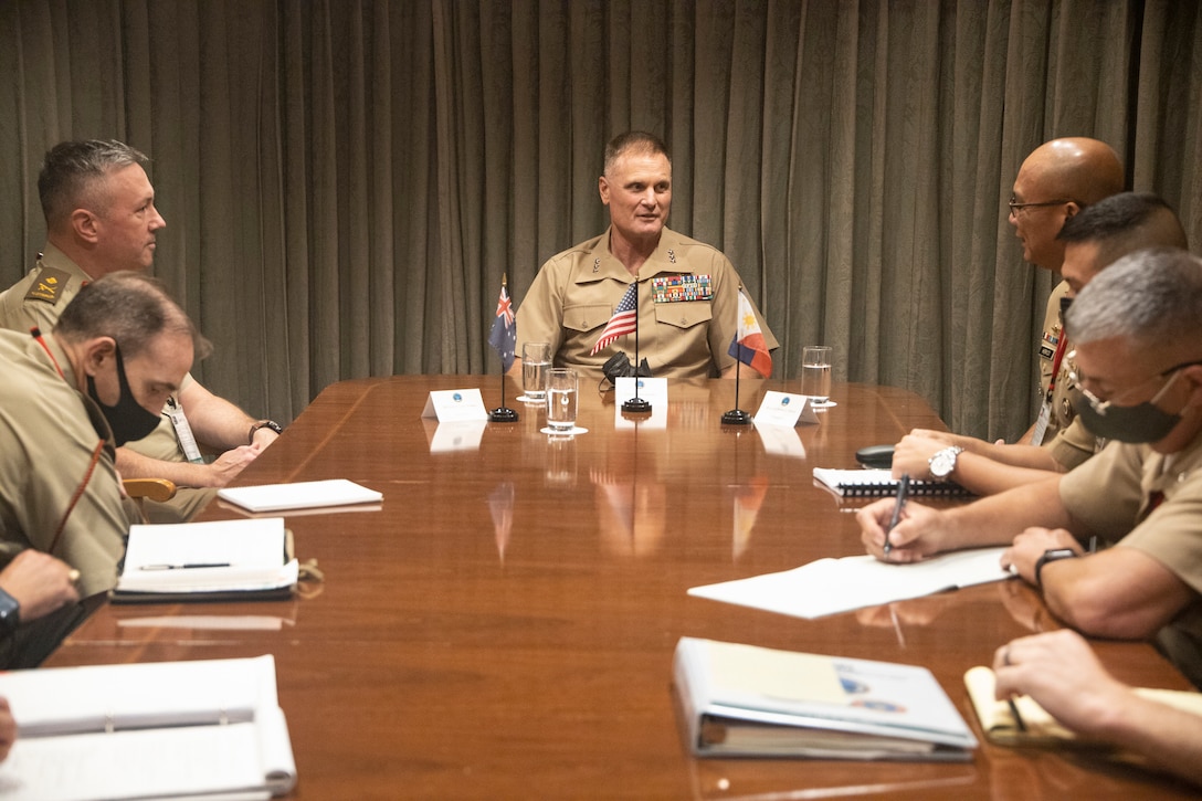 U.S. Marine Corps Lt. Gen. Steven R. Rudder, commander, U.S. Marine Corps Forces, Pacific, Australian Army Maj. Gen. Scott Winter, commander, 1st Division, and Philippine Marine Corps Commandant Maj. Gen. Nestor C. Herico, converse during a trilateral meeting at the eighth iteration of the Pacific Amphibious Leaders Symposium, Tokyo, Japan, June 15, 2022. PALS consists of discussions and presentations conducted to promote regional security and to enable responsive forces during crisis situations. The 2022 symposium brought together senior leaders from 18 participating delegations who are committed to a free and open Indo-Pacific, with the objective of strengthening and developing regional relationships. (U.S. Marine Corps photo by Staff Sgt. Jordan E. Gilbert)