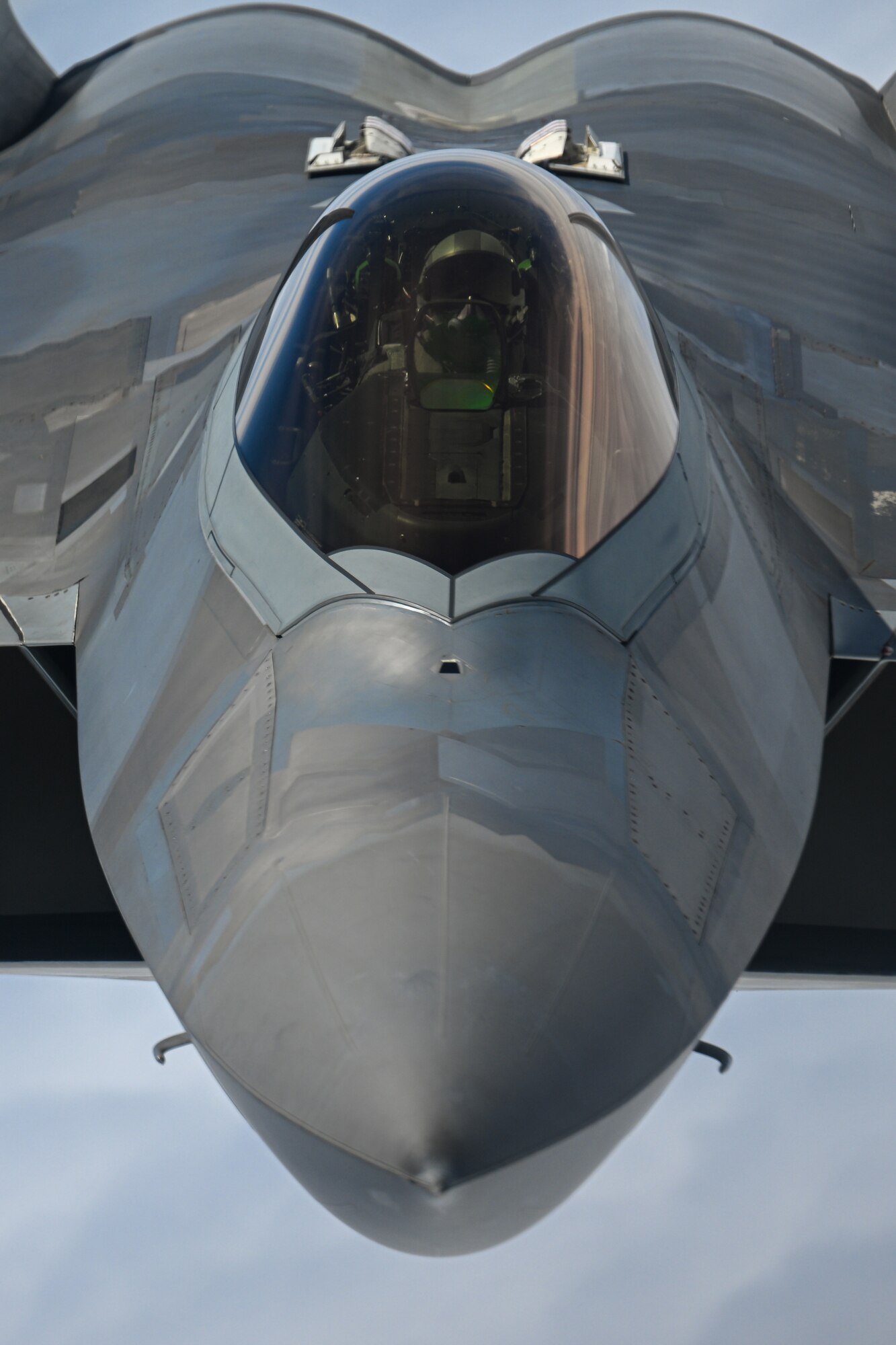A U.S. Air Force F-22 Raptor, deployed to Kadena Air Base, Japan, approaches a KC-135 Stratotanker assigned to the 909th Air Refueling Squadron, Kadena AB, for aerial refueling, June 10, 2022. For decades, Kadena Air Base has served as the Keystone of the Pacific, enabling U.S. power projection. (U.S. Air Force photo by Tech. Sgt. Corban Lundborg)