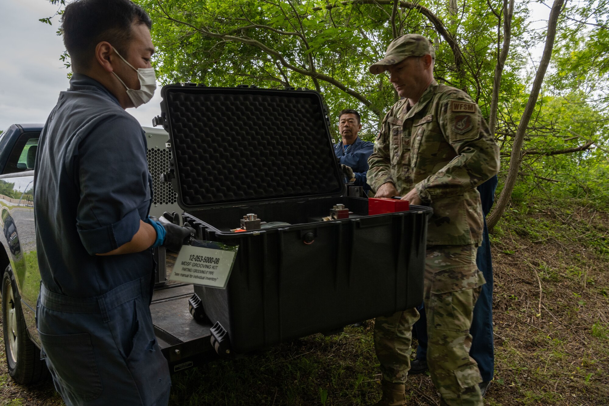 Members from the 35th Civil Engineer Squadron water and fuel system unload the Water and Fuel Expedient Repair System (WaFERS) during setup for the annual Prime Base Engineer Emergency Force (Prime BEEF) at Misawa Air Base, Japan, June 13, 2022.