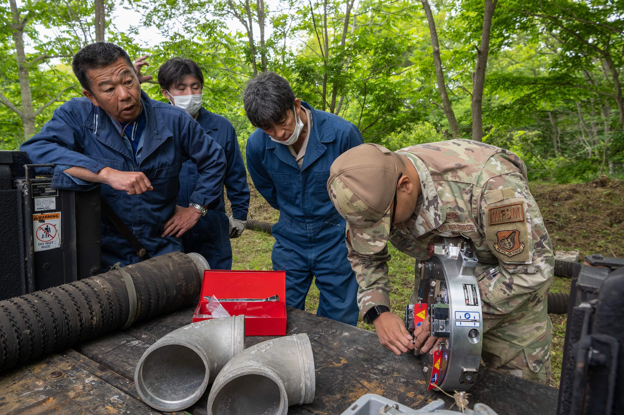 U.S. Air Force Senior Airman Joshua Sanchez, 35th Civil Engineer Squadron water and fuel system journeyman, puts together the new Water and Fuel Expedient Repair System (WaFERS) during setup for the annual Prime Base Engineer Emergency Force (Prime BEEF) at Misawa Air Base, Japan, June 13, 2022.