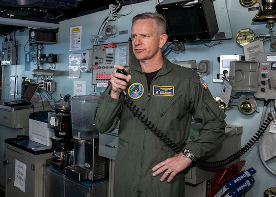 ATLANTIC OCEAN (June 9, 2022) Vice Adm. Daniel Dwyer, commander, U.S. 2nd Fleet and Joint Forces Command Norfolk, speaks to Sailors over the ships announcing system during a visit to the Nimitz-class aircraft carrier USS George H.W. Bush (CVN 77), June 9, 2022. The George H.W. Bush Carrier Strike Group (CSG) is underway completing a certification exercise to increase U.S. and allied interoperability and warfighting capability before a future deployment. The George H.W. Bush CSG is an integrated combat weapons system that delivers superior combat capability to deter, and if necessary, defeat America's adversaries in support of national security. (U.S. Navy photo by Mass Communication Specialist 3rd Class Joshua Cabal)