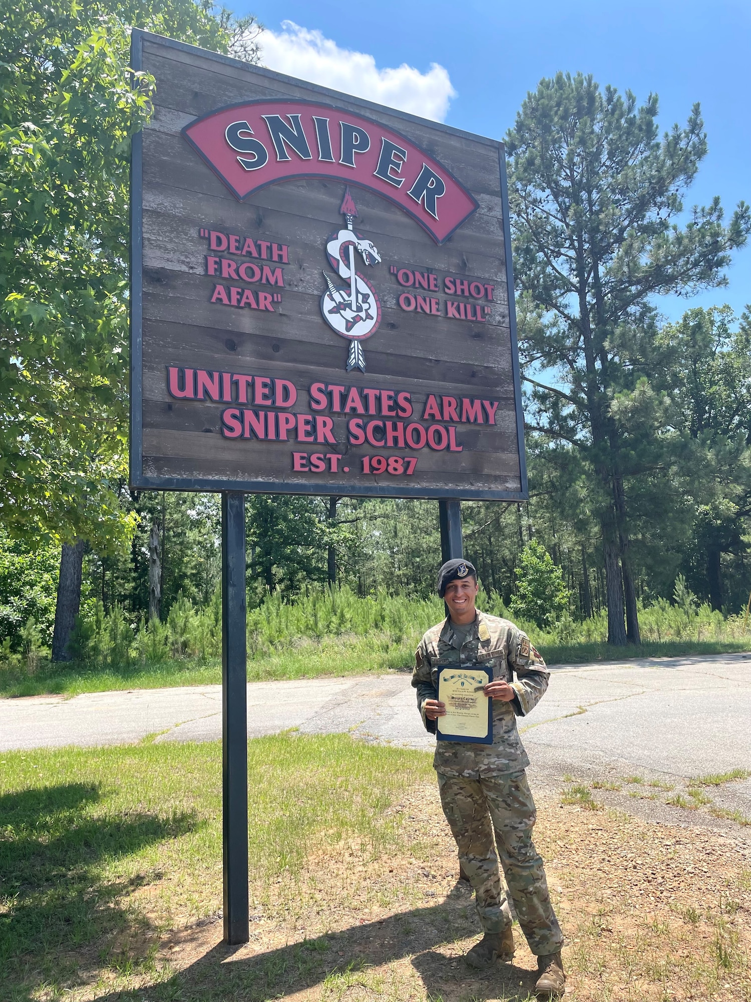 U.S. Air Force Senior Airman Tarriq Releford, 14th Security Forces Squadron, installation entry controller, graduates from Army Sniper School, Jun. 3, 2022, at Fort Benning, Ga. During the 53-day, U.S. Army Sniper Course, participants receive training in fieldcraft skills; advanced camouflage techniques, concealed movement, target detection, range estimation, etc. (U.S. Air Force photo by Airman 1st Class Jessica Haynie)