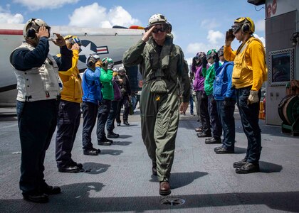 ATLANTIC OCEAN (June 8, 2022) Vice Adm. Daniel Dwyer, commander, Second Fleet/Joint Force Command Norfolk, comes aboard the Nimitz-class aircraft carrier USS George H.W. Bush (CVN 77), June 8, 2022. The George H.W. Bush Carrier Strike Group (CSG) is underway completing a certification exercise to increase U.S. and allied interoperability and warfighting capability before a future deployment. The George H.W. Bush CSG is an integrated combat weapons system that delivers superior combat capability to deter, and if necessary, defeat America's adversaries in support of national security. Carrier Air Wing (CVW) 7 is the offensive air and strike component of CSG-10 and the George H.W. Bush CSG. (U.S. Navy photo by Mass Communication Specialist 3rd Class Brandon Roberson)