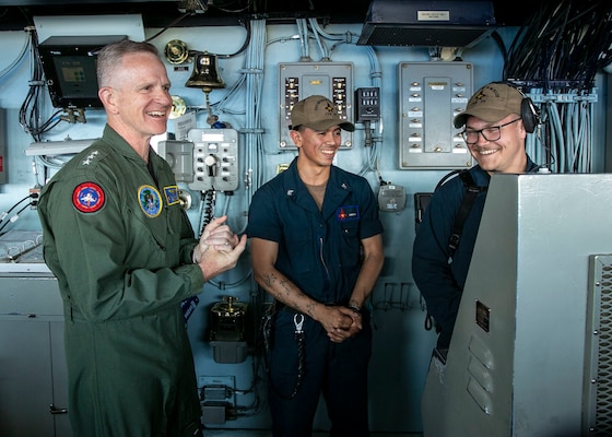ATLANTIC OCEAN (June 9, 2022) Vice Adm. Daniel Dwyer, commander, U.S. 2nd Fleet and Joint Forces Command Norfolk, left, speaks with Sailors assigned to the Nimitz-class aircraft carrier USS George H.W. Bush (CVN 77), during a visit to the ship, June 9, 2022. The George H.W. Bush Carrier Strike Group (CSG) is underway completing a certification exercise to increase U.S. and allied interoperability and warfighting capability before a future deployment. The George H.W. Bush CSG is an integrated combat weapons system that delivers superior combat capability to deter, and if necessary, defeat America's adversaries in support of national security. (U.S. Navy photo by Mass Communication Specialist 3rd Class Joshua Cabal)
