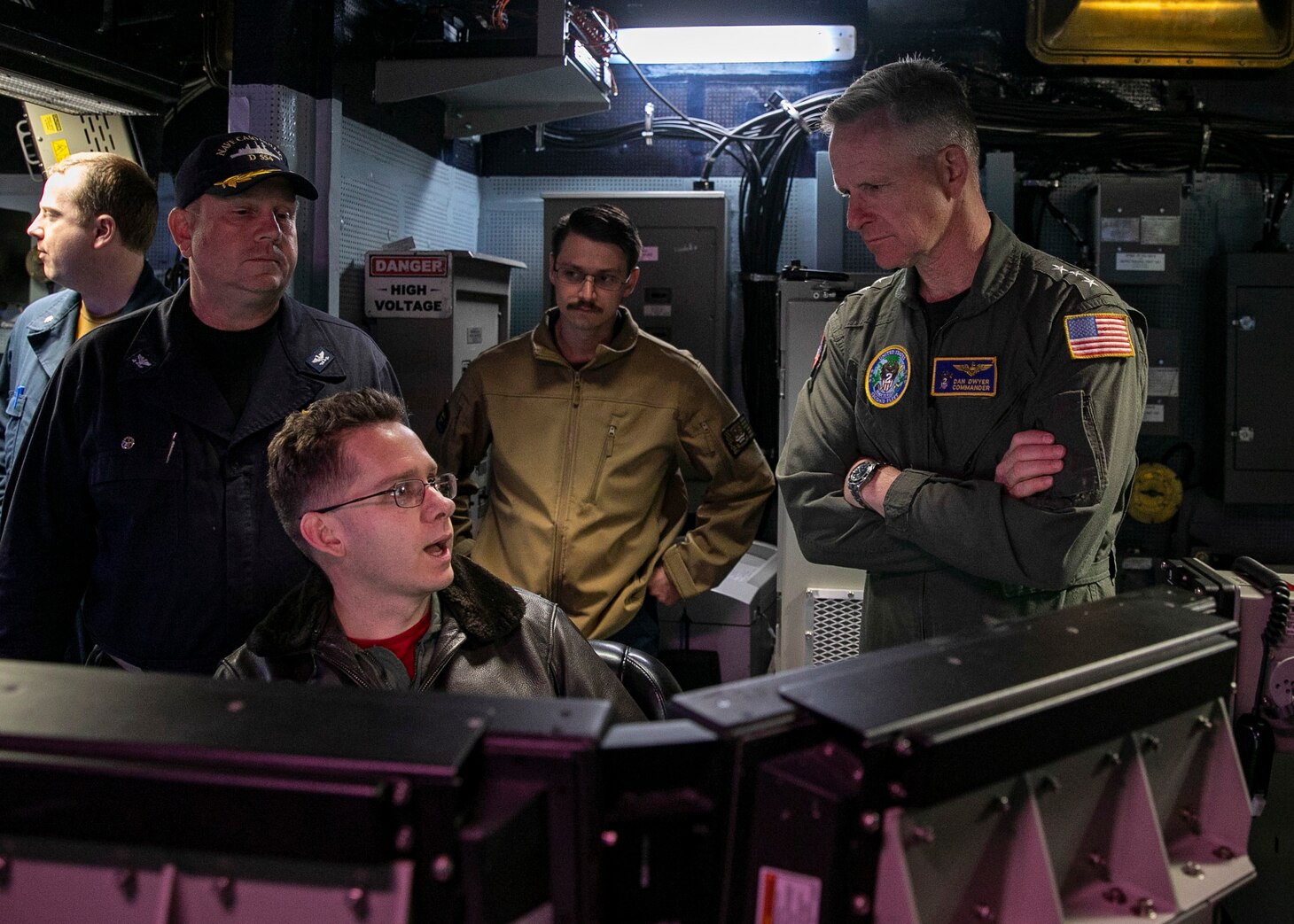 220609-N-QP737-1045 ATLANTIC OCEAN (June 9, 2022) Vice Adm. Daniel Dwyer, commander, U.S. 2nd Fleet and Joint Forces Command Norfolk, right, speaks with Lt. David Spencer, during a visit to the Nimitz-class aircraft carrier USS George H.W. Bush (CVN 77), June 9, 2022. The George H.W. Bush Carrier Strike Group (CSG) is underway completing a certification exercise to increase U.S. and allied interoperability and warfighting capability before a future deployment. The George H.W. Bush CSG is an integrated combat weapons system that delivers superior combat capability to deter, and if necessary, defeat America's adversaries in support of national security. (U.S. Navy photo by Mass Communication Specialist 3rd Class Joshua Cabal)