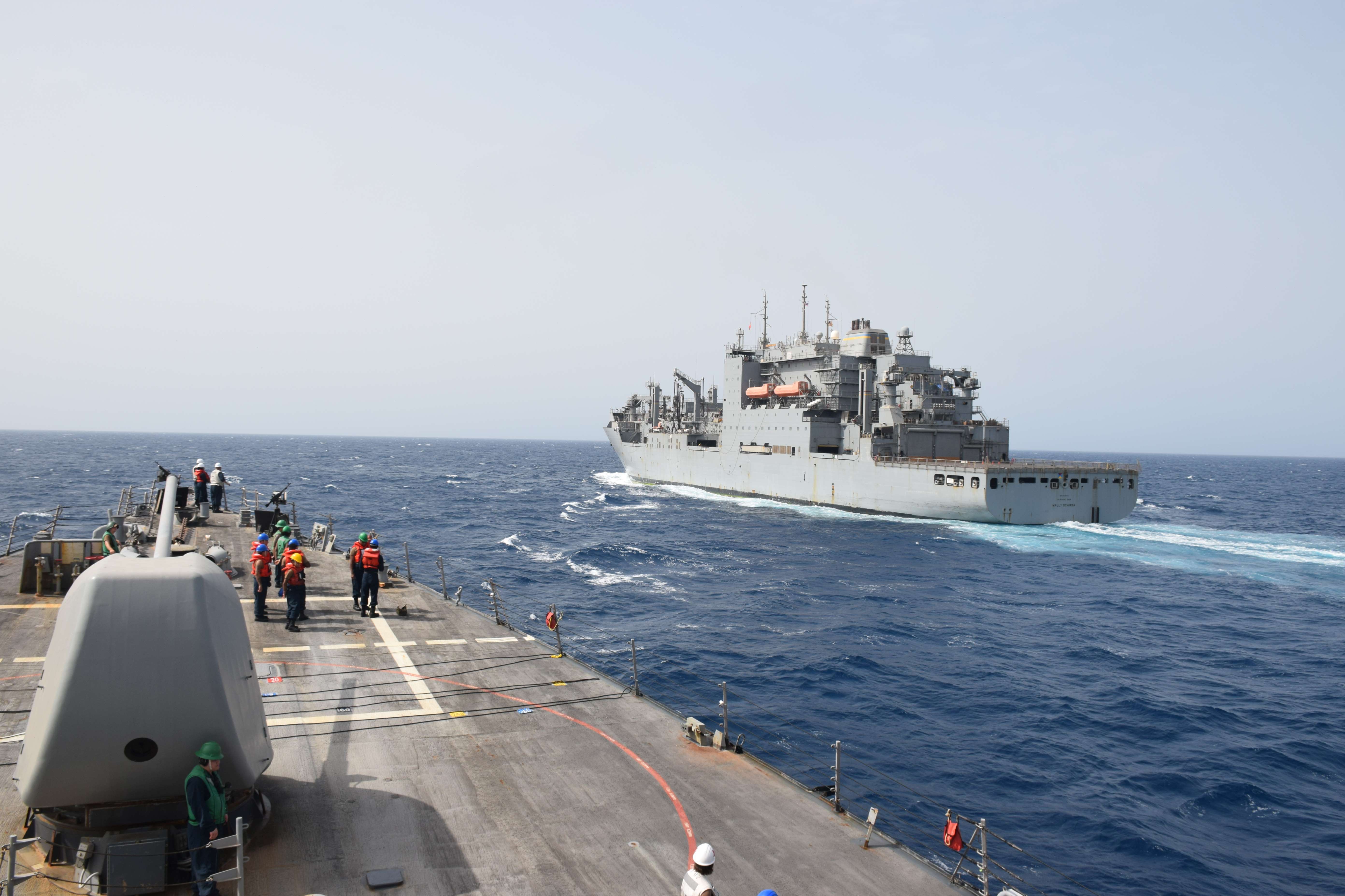 The guided-missile destroyer USS Gonzalez (DDG 66) approaches the military Sealift Command dry cargo ammunition ship USNS Wally Schirra (T-AKE 8) during an underway replenishment in the Red Sea.