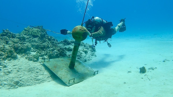 TINIAN, NORTHERN MARIANA ISLANDS (Jun. 14, 2022)

Explosive Ordnance Disposal Technician 2nd Class Orin Olds, assigned to Explosive Ordnance Disposal Mobile Unit (EODMU) 5, Platoon 501 conducts diving operations to neutralize inert training mines in support of Exercise Valiant Shield 2022. Exercises such as Valiant Shield allow the Indo-Pacific Command Joint Forces the opportunity to integrate forces from all branches of service to conduct precise, lethal, and overwhelming multi-axis, multi-domain effects that demonstrate the strength and versatility of the Joint Force and our commitment to a free and open Indo-Pacific. (U.S. Navy photos by Lt. Tyler Baldino/Released)