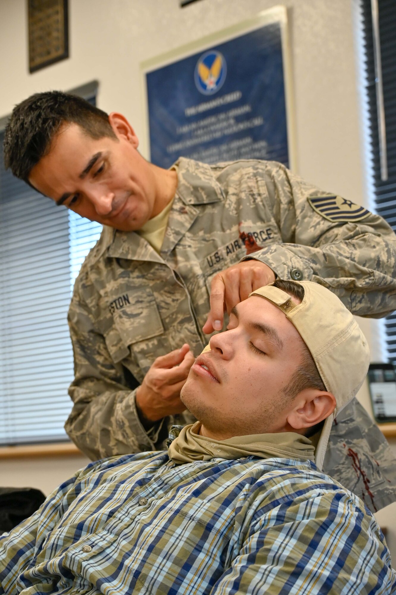 162nd Medical Group personnel prepare mock patients with simulated injuries for an “active shooter” exercise in which students from the 4-day Tactical Combat Casualty Care (TCCC) and Combat LifeSaver (CLS) courses practiced their new skills.