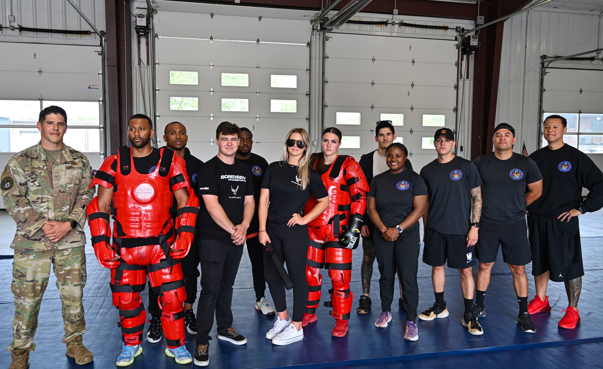 U.S. Air Force Airmen from the 87th Security Forces Squadron pose with Formula Drift drivers Branden and Amanda Sorenson during a tour at Joint Base McGuire-Dix-Lakehurst on June 7, 2022. Drift team duo Branden and Amanda Sorensen visited JB MDL to interact with Airmen and learn about different Air Force career fields. Air Force Recruiting Service recently continued their 13-year partnership with the Formula Drift series. Throughout the 2022 Formula Drift circuit, the Air Force will serve as the primary sponsor for the Sorensen Motorsports team.