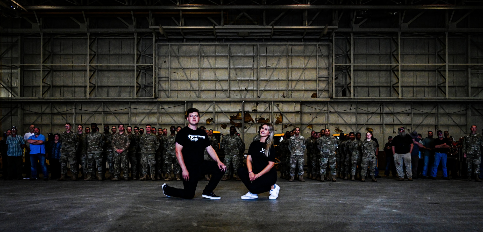 Formula Drift drivers Branden and Amanda Sorenson pose for a group photo with the 87th Civil Engineering Squadron at Joint Base McGuire-Dix-Lakehurst on June 7, 2022. Drift team duo Branden and Amanda Sorensen visited JB MDL to interact with Airmen and learn about different Air Force career fields. Air Force Recruiting Service recently continued their 13-year partnership with the Formula Drift series. Throughout the 2022 Formula Drift circuit, the Air Force will serve as the primary sponsor for the Sorensen Motorsports team.