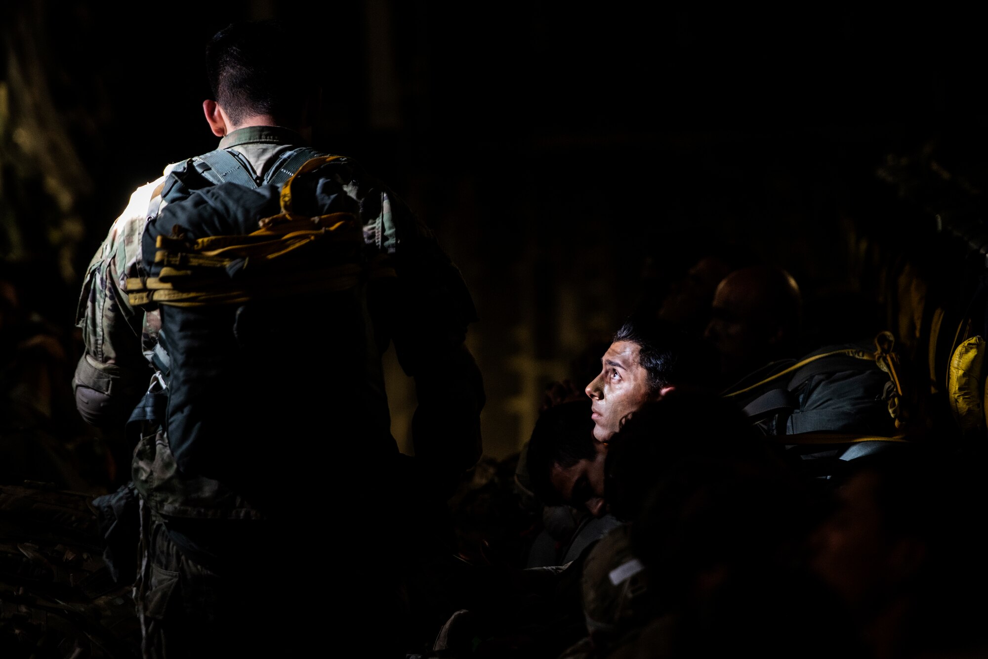 U.S. Army paratroopers wait inside a C-17 Globemaster III assigned to the 517th Airlift Squadron, Joint Base Elmendorf-Richardson, Alaska prior to jumping at Allen Army Airfield, Fort Greely, June 15, 2022 during RED FLAG-Alaska 22-2. RF-A provides realistic combat training by integrating joint, coalition and multilateral forces into simulated forward operating bases. (U.S. Air Force photo by Sheila deVera)