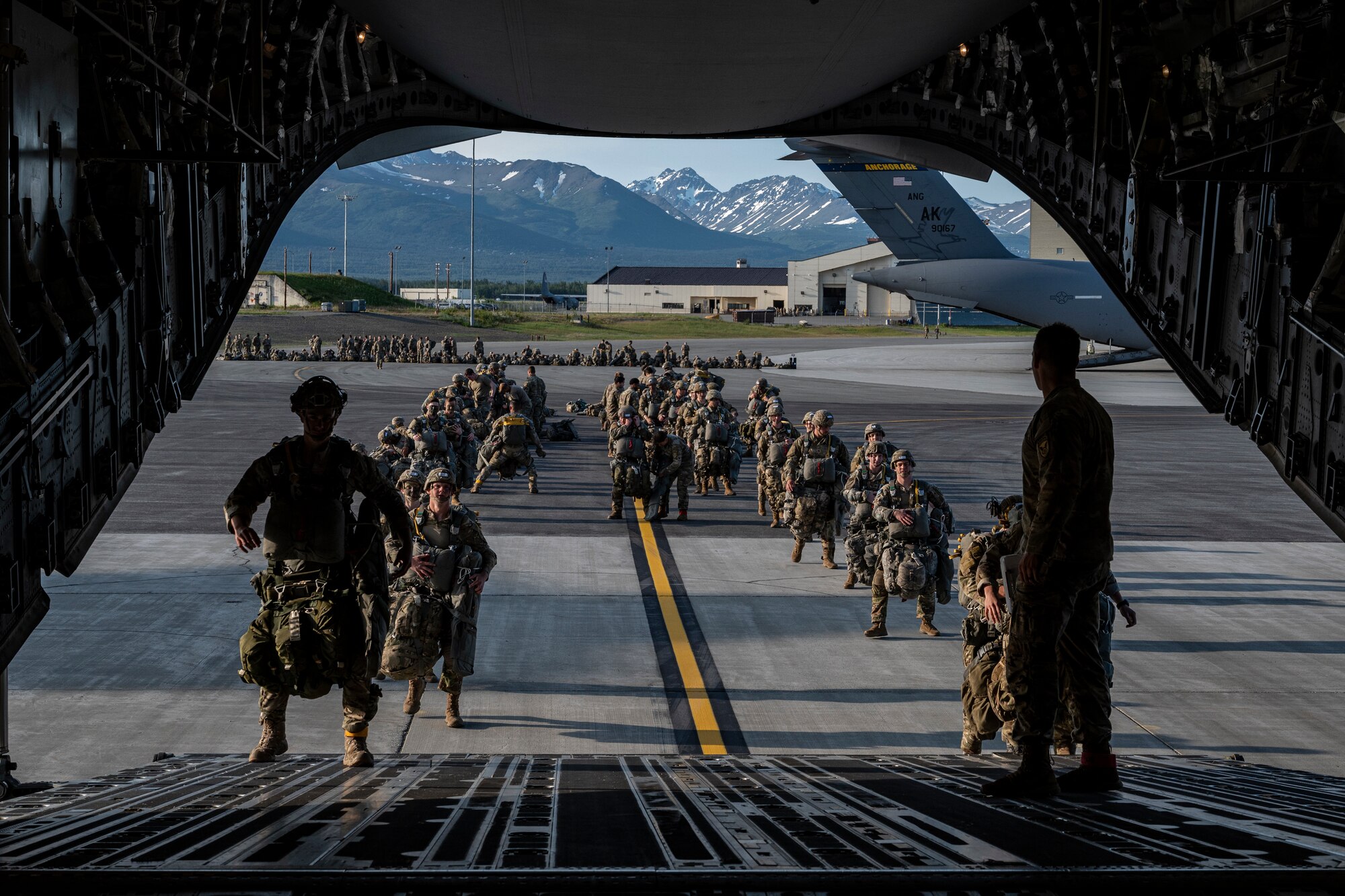 U.S. Army Paratroopers, Air Force joint terminal attack controller and Special Tactic Operators board a C-17 Globemaster III from the 517th Airlift Squadron at Joint Base Elmendorf-Richardson, Alaska, June 15, 2022 during RED FLAG-Alaska 22-2. Approximately 1,600 service members from three nations participate in flying, maintaining and supporting more than 70 aircraft from over 22 units during this iteration of exercise. The Paratroopers are assigned to the 2nd Infantry Brigade Combat Team (Airborne), 11th Airborne Division, JTACs are assigned to the 3rd Air Operation Squadron both at JBER and ST operators are assigned to the 23rd Special Tactics Squadron, Hurlburt Field, Florida. (U.S. Air Force photo by Sheila deVera)